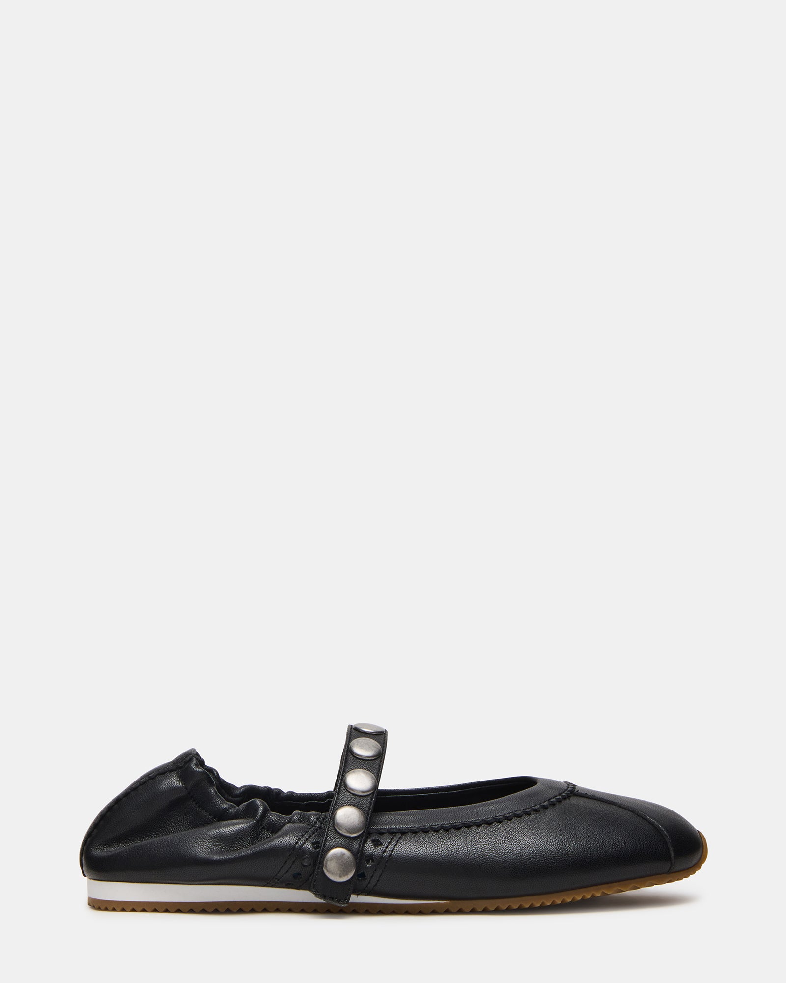 Black Mary Jane shoes displayed on a stylish surface.