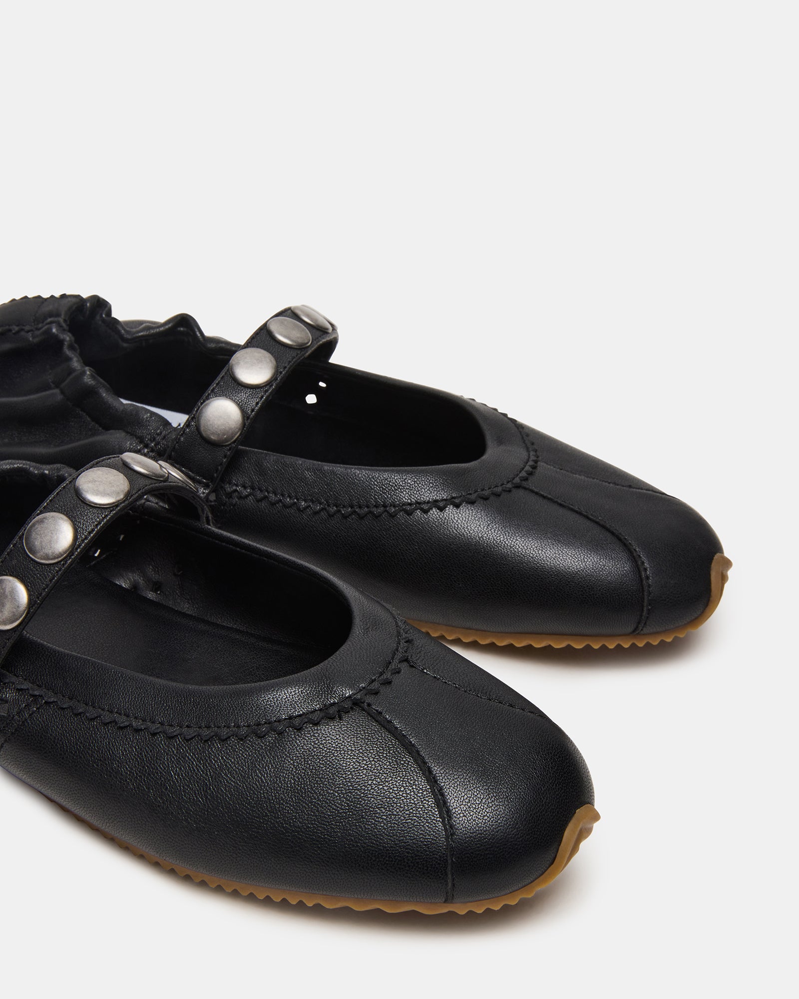 Close-up of the leather material and cushioned insole of the shoes.