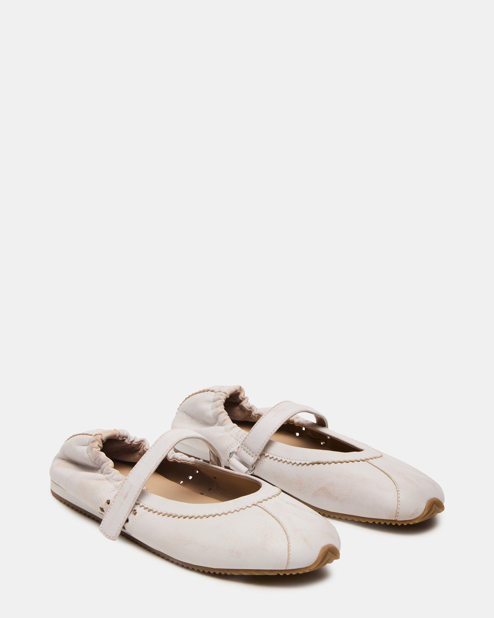 Close-up of cushioned insole inside comfortable flats, perfect for daily use