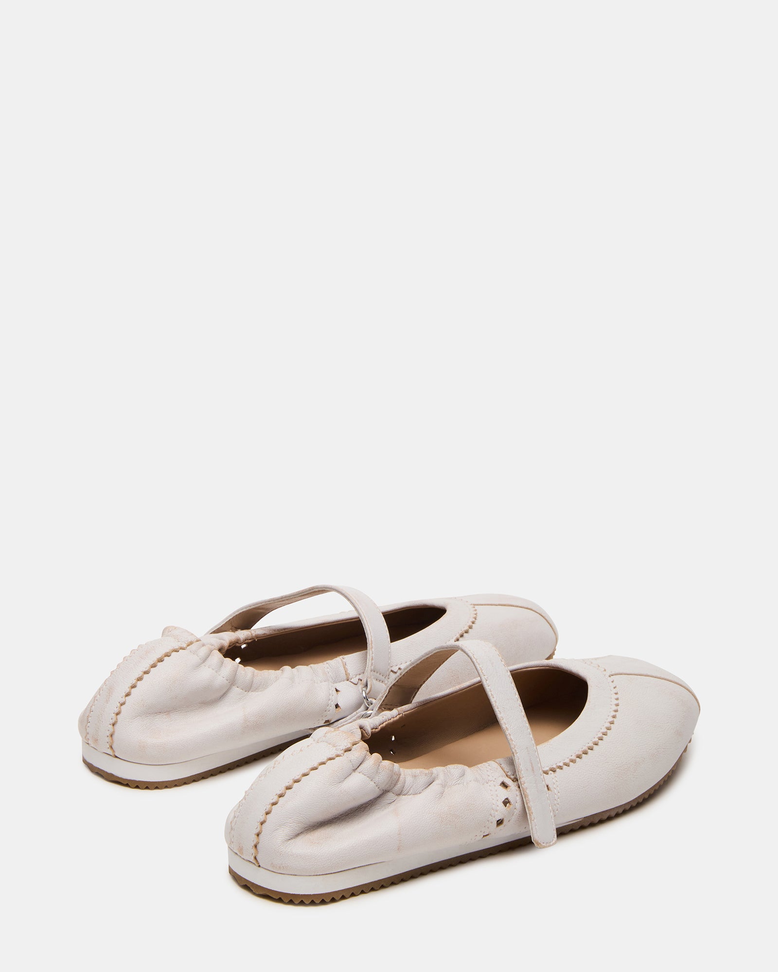 Close-up of cushioned insole inside comfortable flats, perfect for daily use