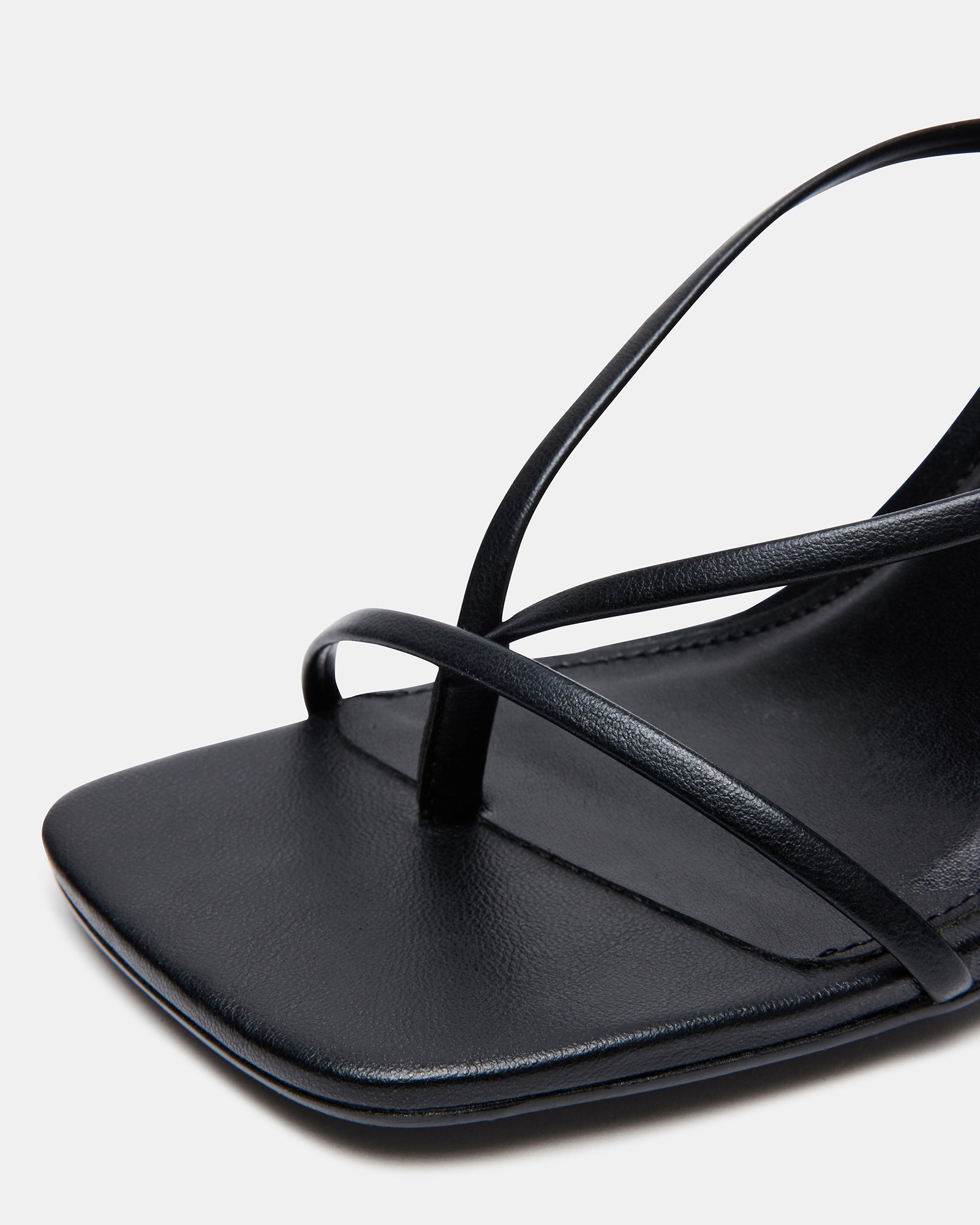 Close-up of vegan leather texture and stiletto heel design