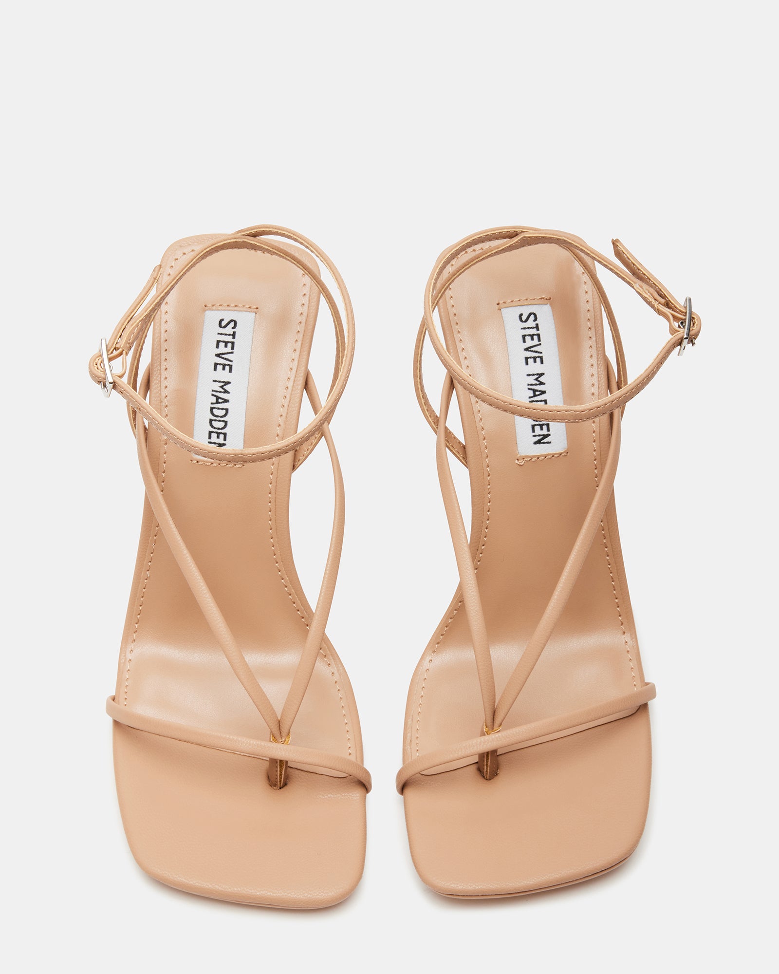 Side view of womens pink high heels showcasing strappy design.