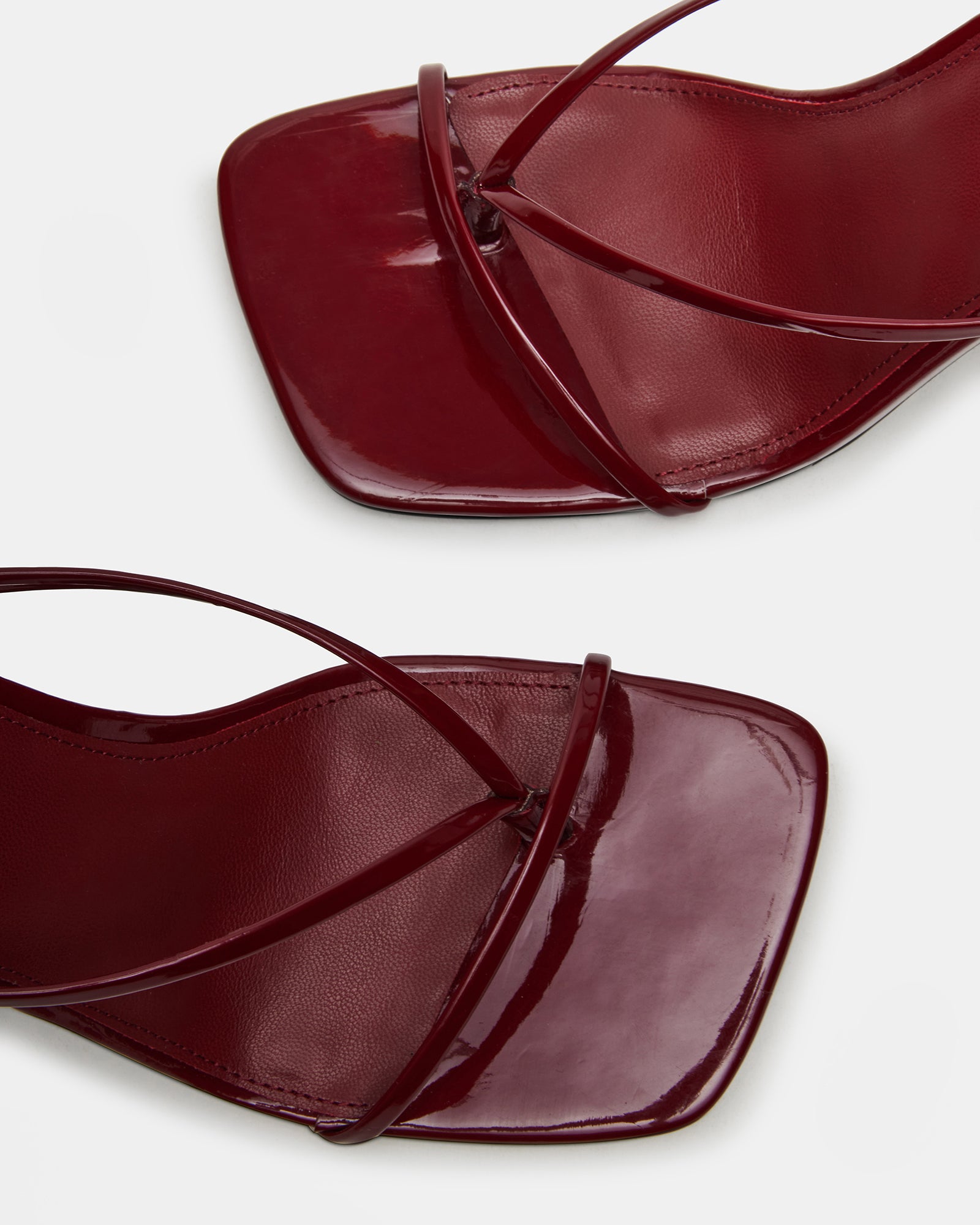 Side profile of high heel shoes on marble background, perfect for cocktail wear