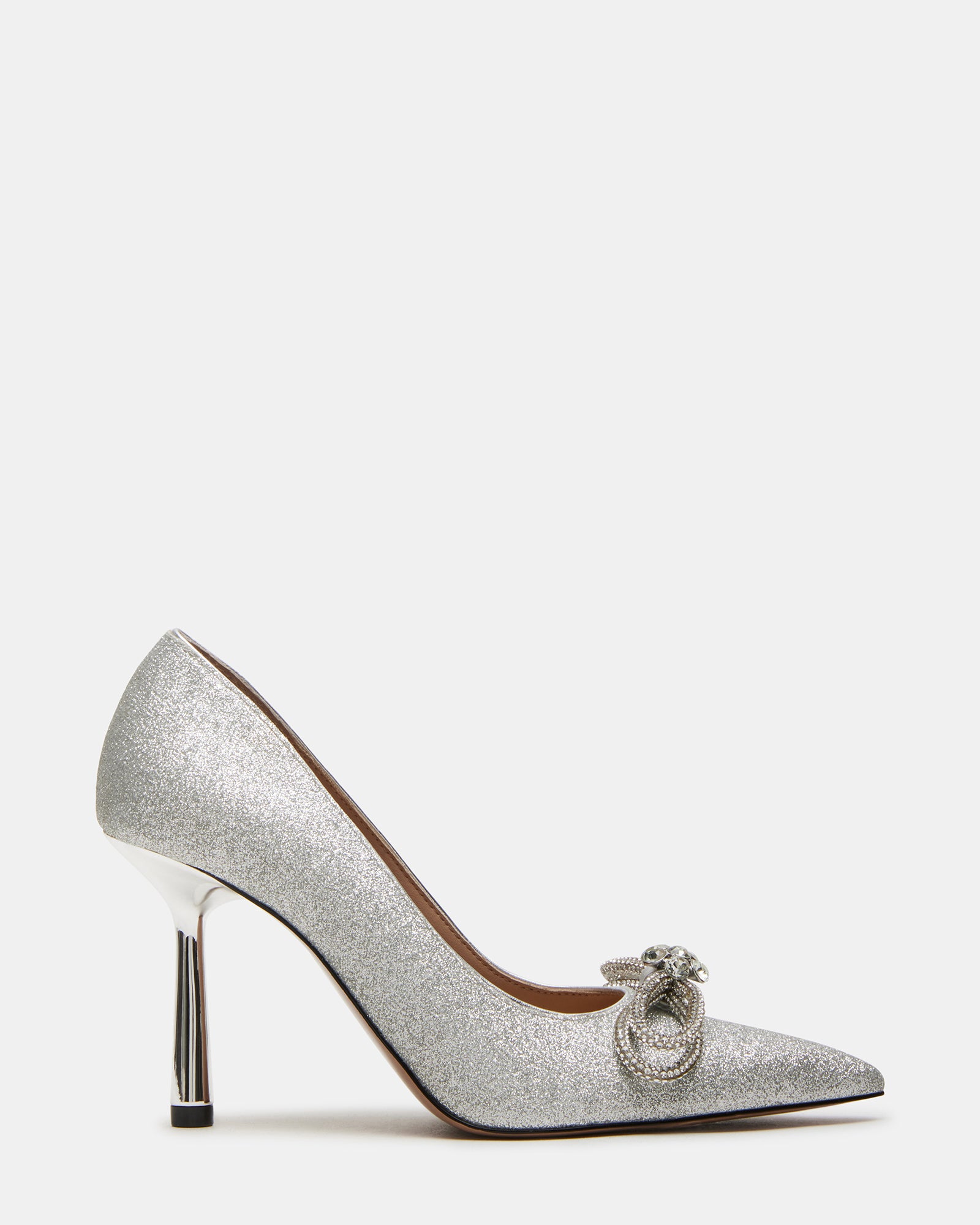 Silver platform heels with bow detail, worn with evening dress