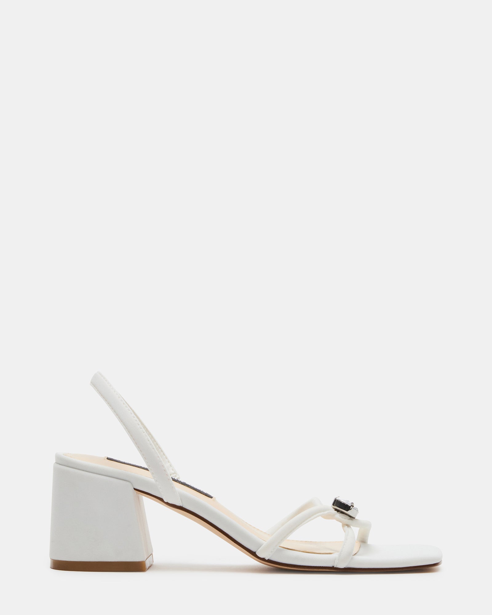 Close-up of white slingback sandals with square toe and embellished strap