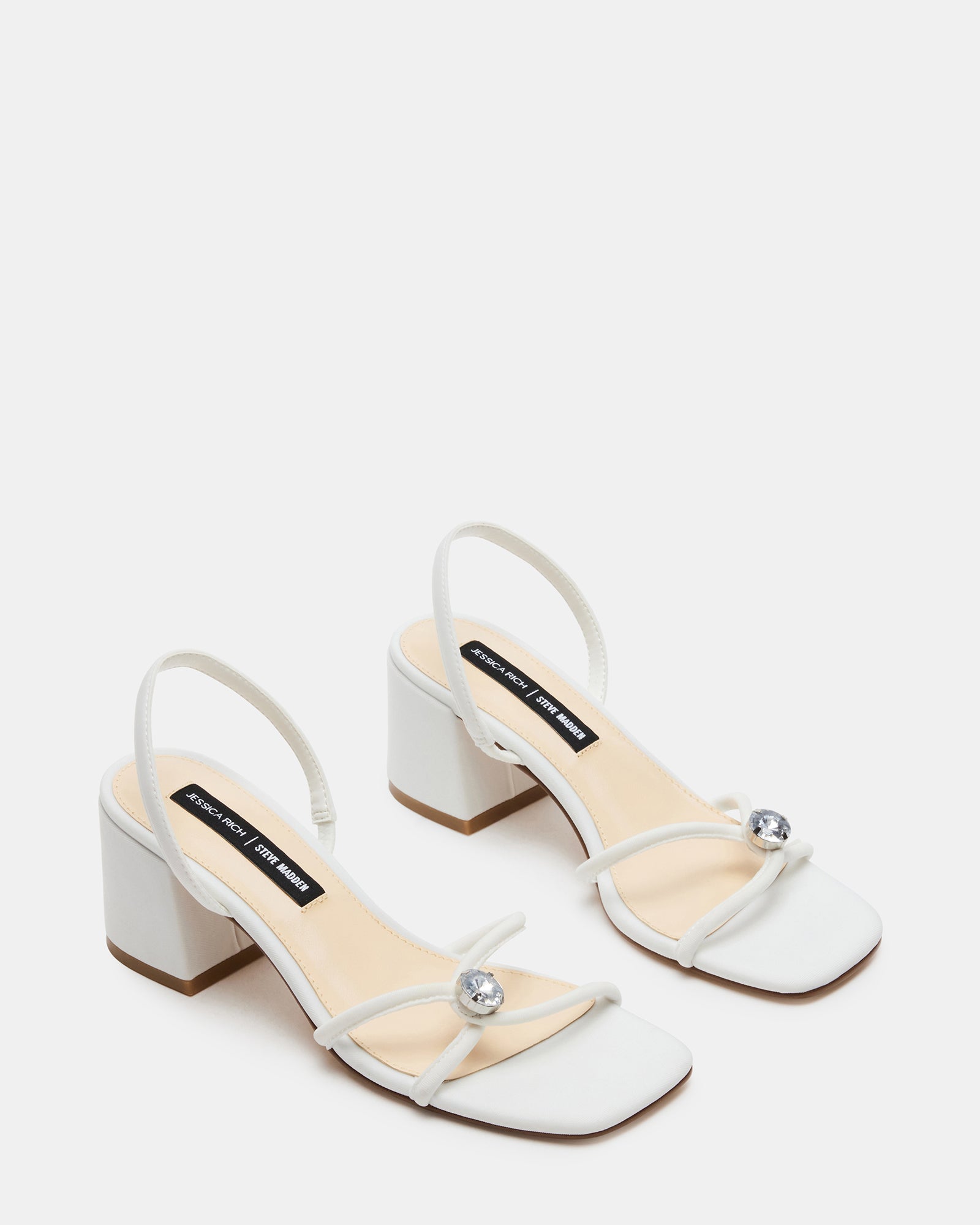 Overhead shot of block heel sandals on rustic wood floor