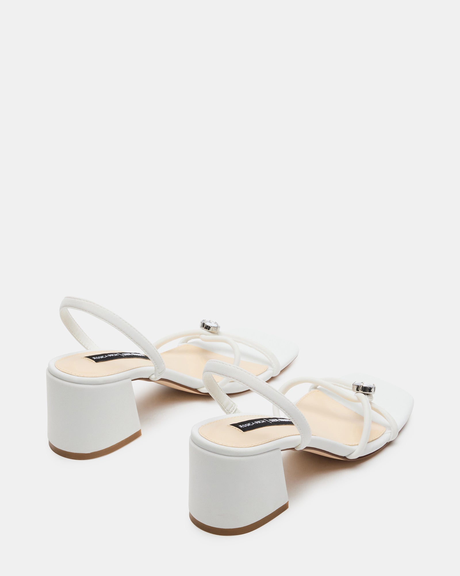 Overhead shot of block heel sandals on rustic wood floor