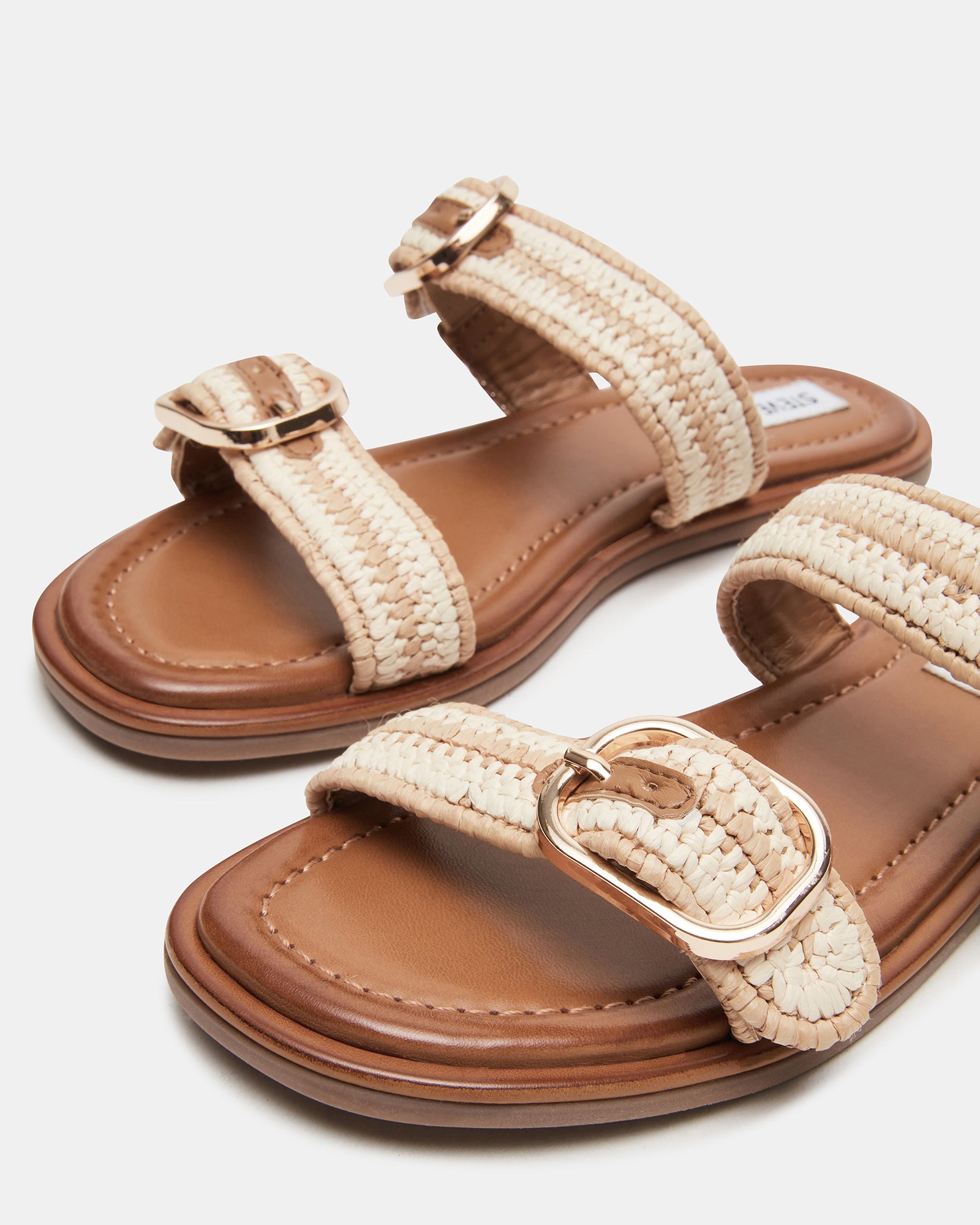 A stylish outfit featuring Aperol sandals with a casual dress.