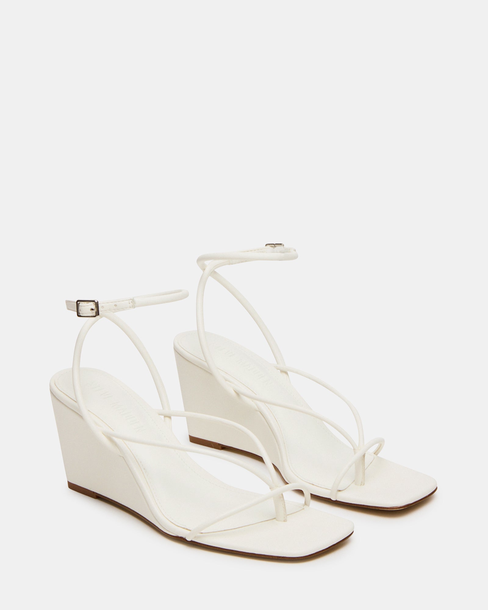 Close-up of the sole and heel of APPA white wedge sandals highlighting craftsmanship