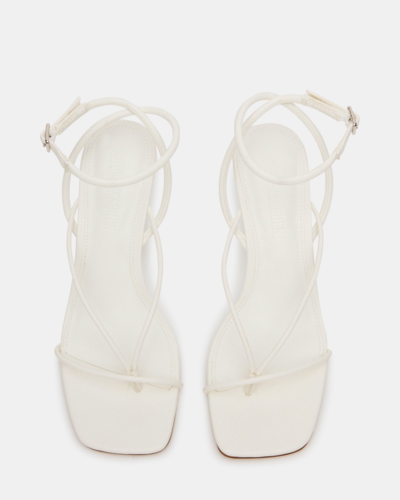 Model wearing APPA white wedge sandals with a summer dress for a chic look