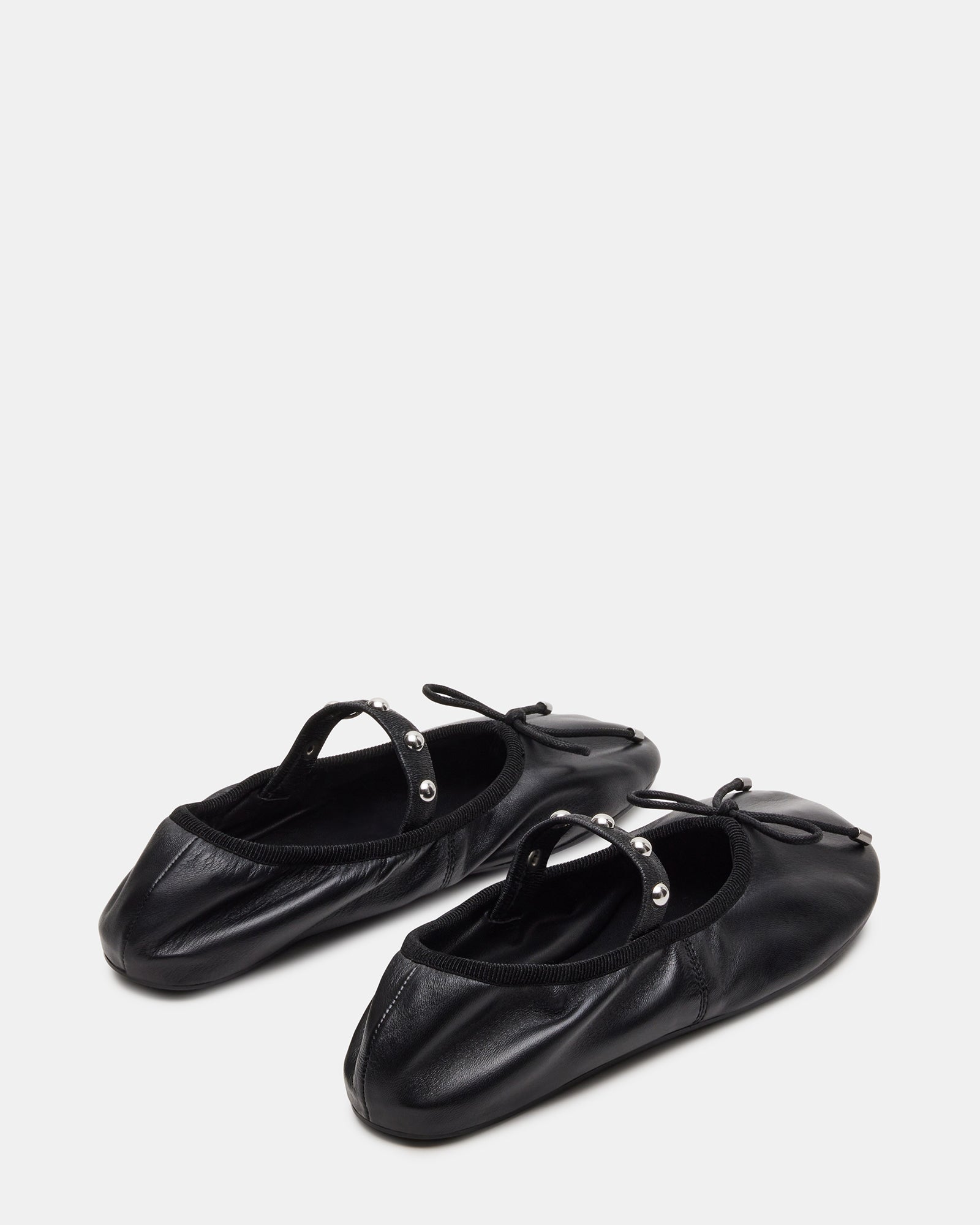 Close-up of the leather texture and stitching on the ballet flats
