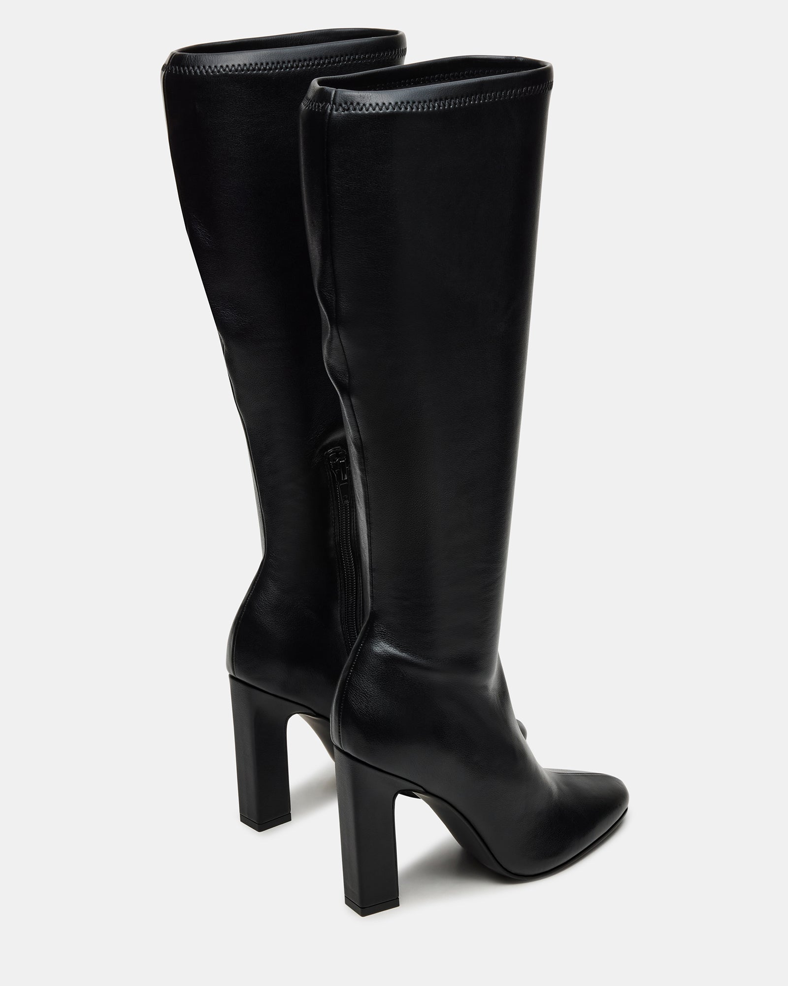 Close-up of the vegan leather texture and heel detail on Aria boots