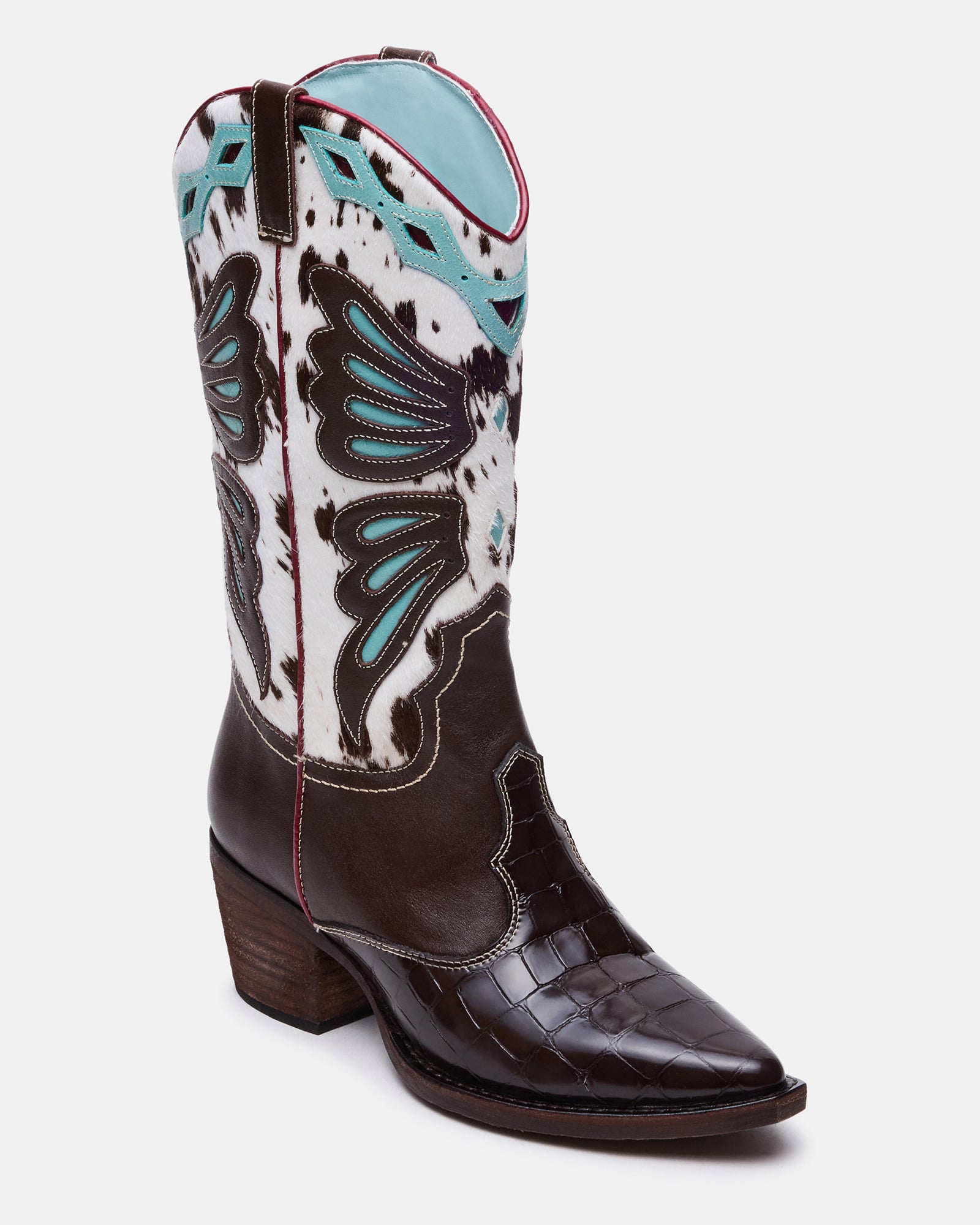 Close-up of black pointed toe boots showing multi-tone leather finish