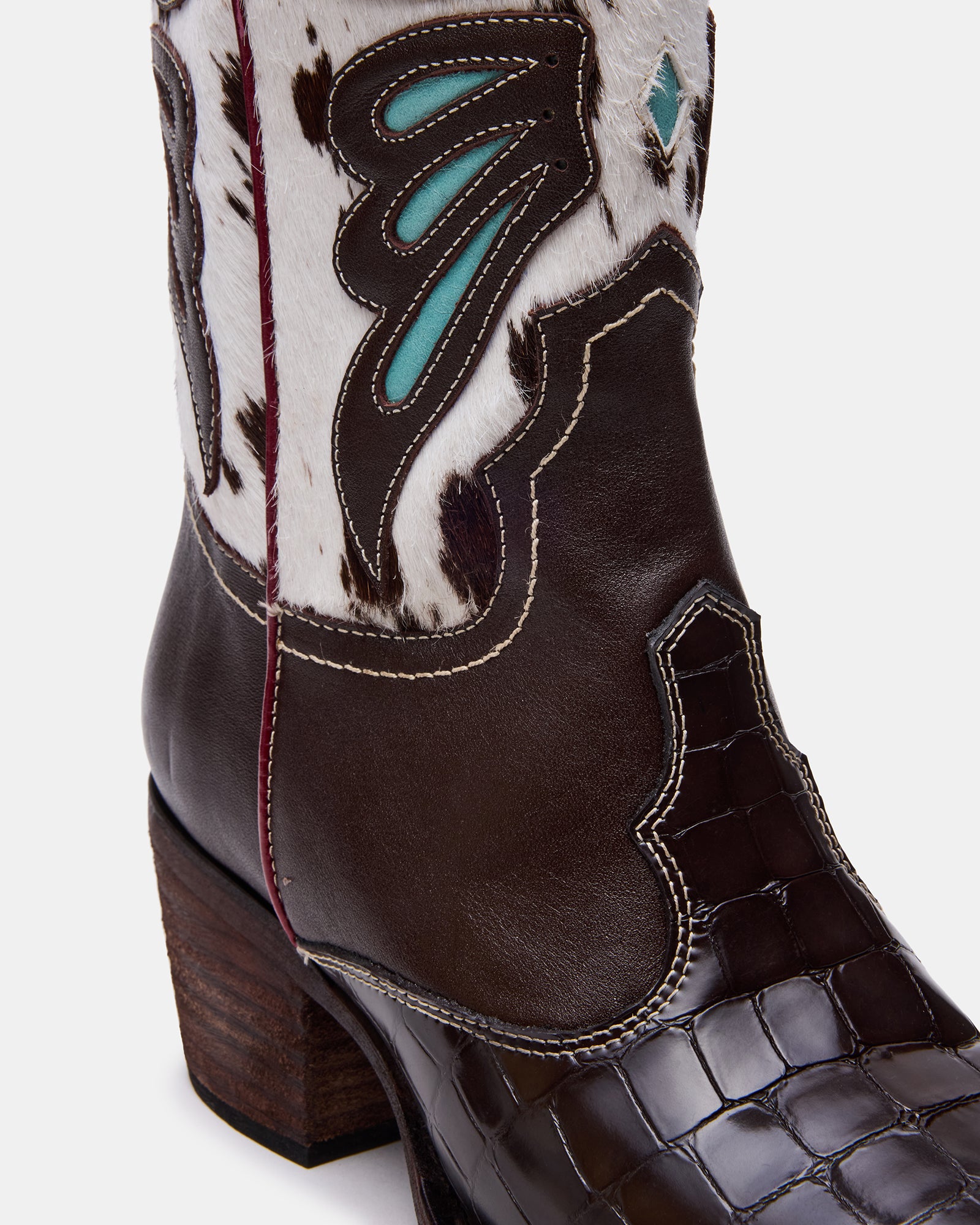 Back view of womens wide shaft cowboy boots styled with denim for everyday wear