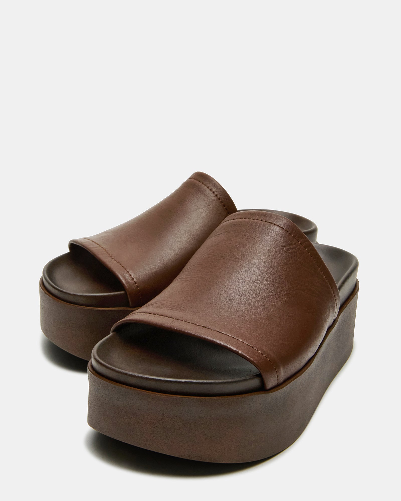 Side view of Arwen brown leather platform sandals showcasing the rounded toe design.