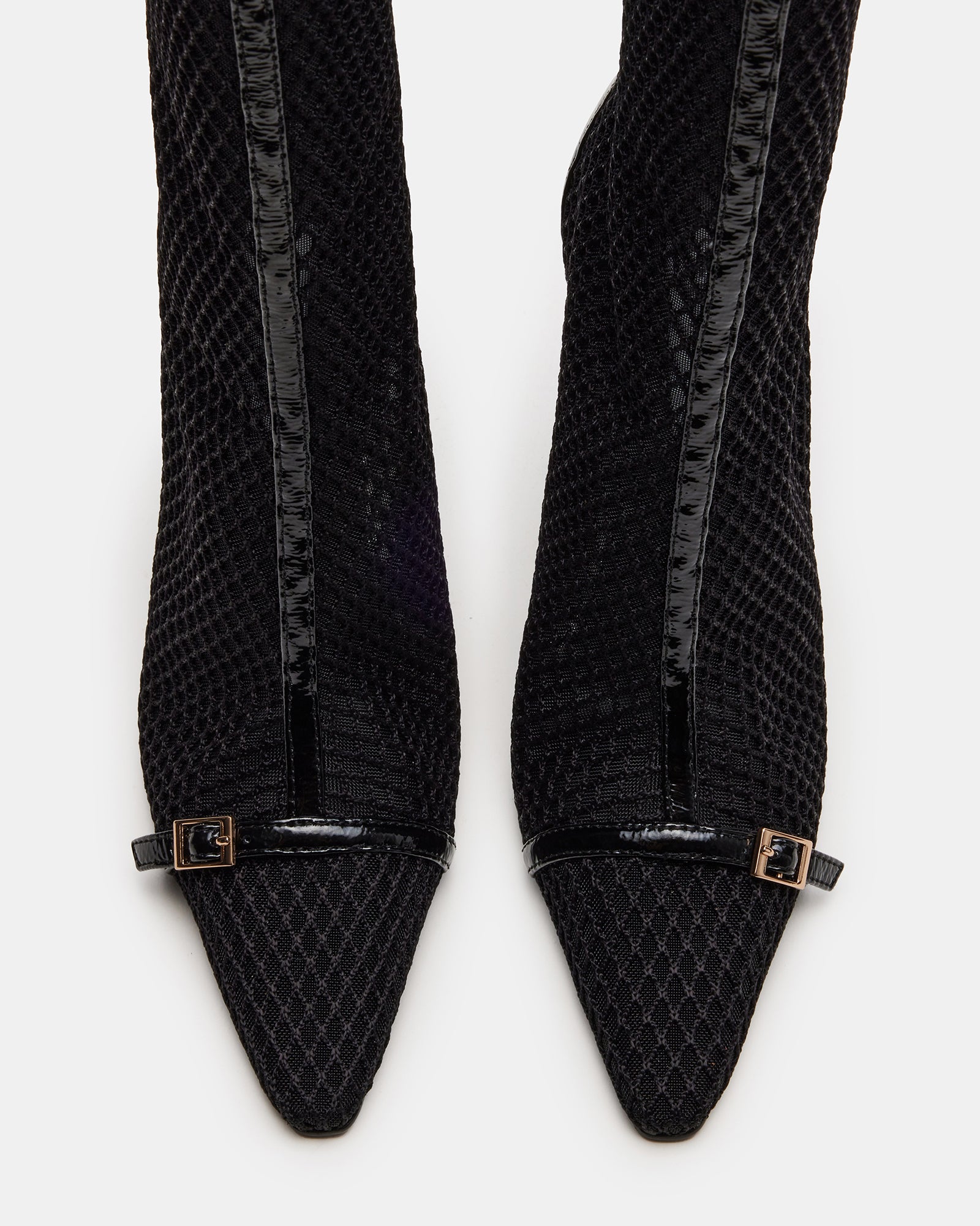 Side view of ASHLIN black stiletto heel ankle boots showcasing the pointed toe.