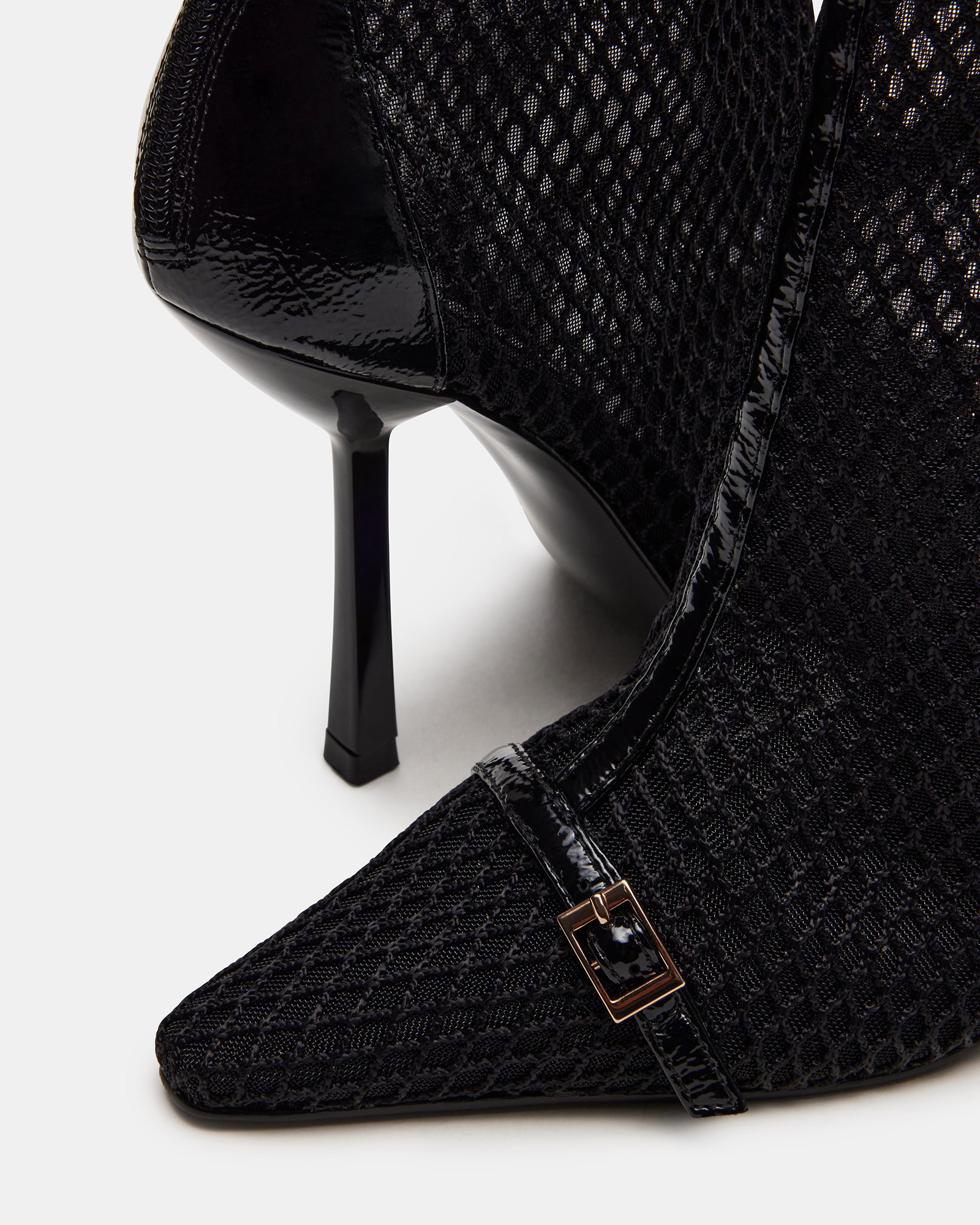 ASHLIN black ankle boots styled with a fashionable outfit for a night out.