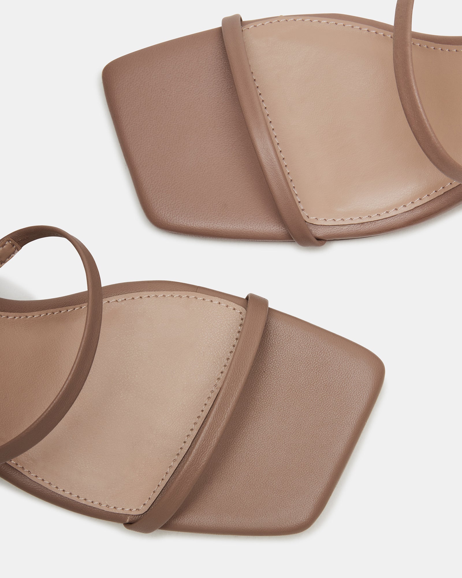 Close-up of the block heel and ankle strap on Ashlynn sandals.