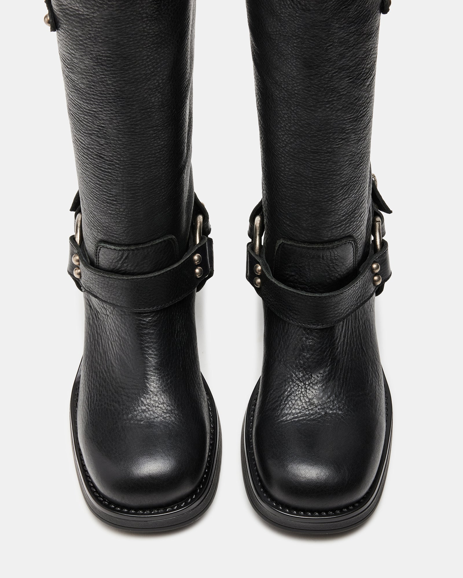 Side view of Astor black leather engineer boots with buckle straps and square toe