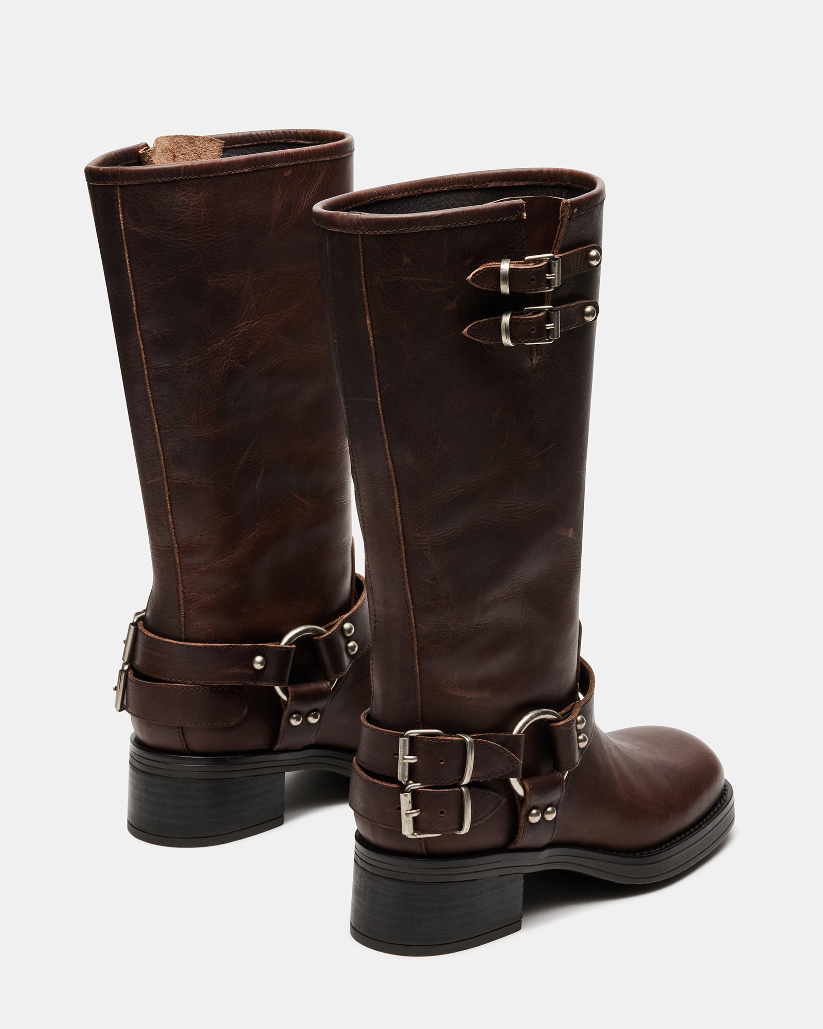 Close-up of knee-high leather boots with square toe design