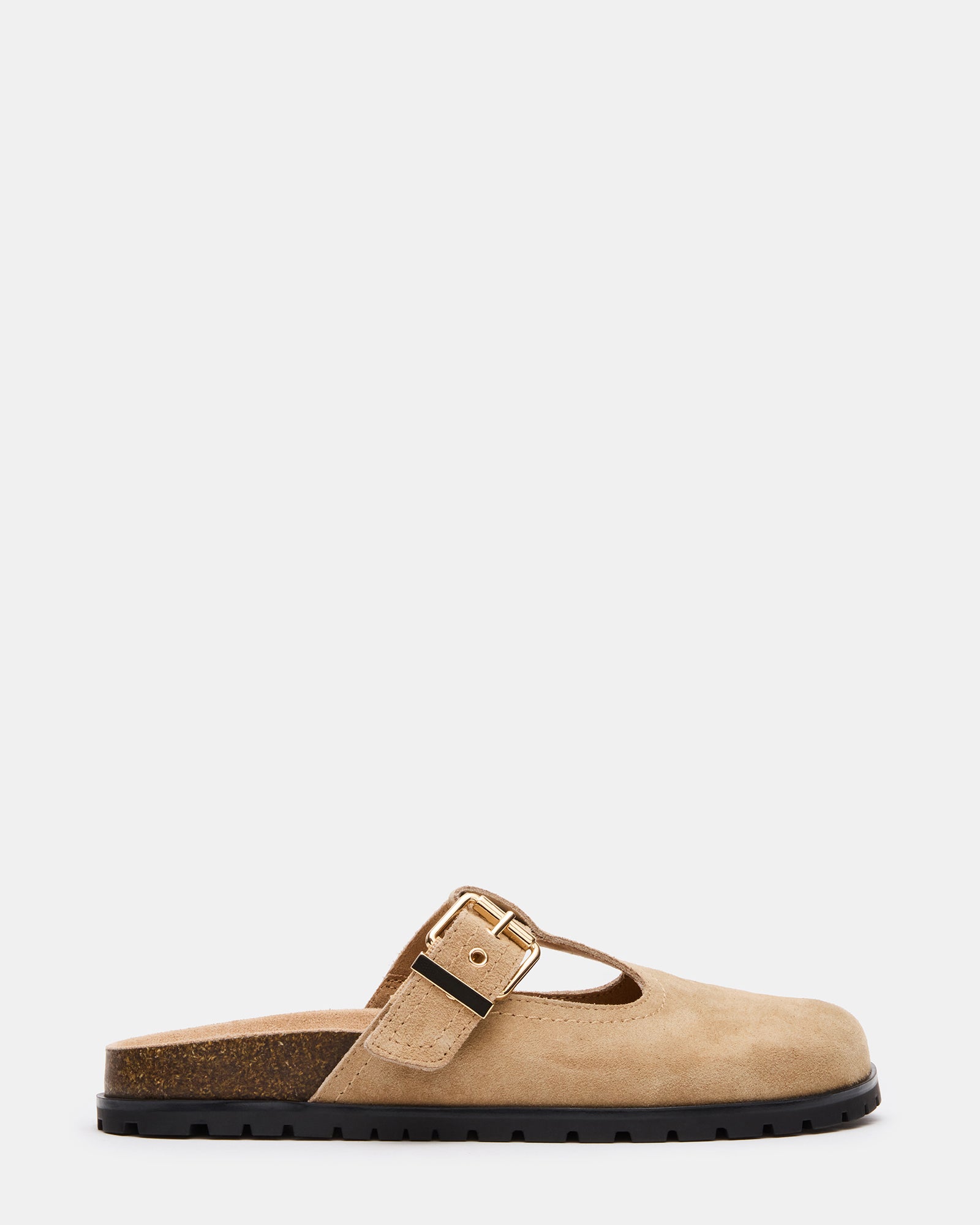 Taupe suede mules with buckle detail on a model's feet, showcasing stylish clog shoes.