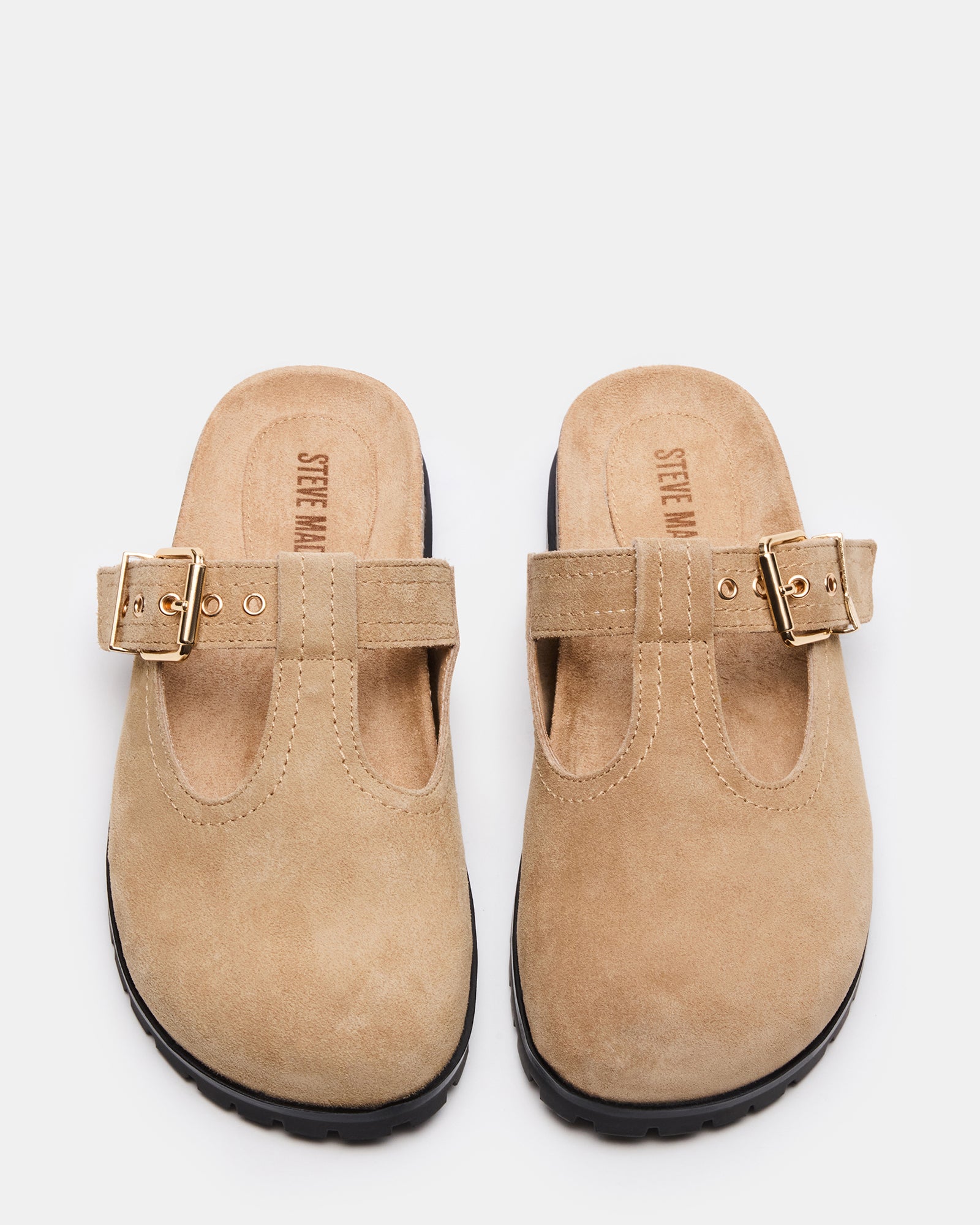 Side view of Atticus Taupe suede mules highlighting the 1-inch heel and elegant design.