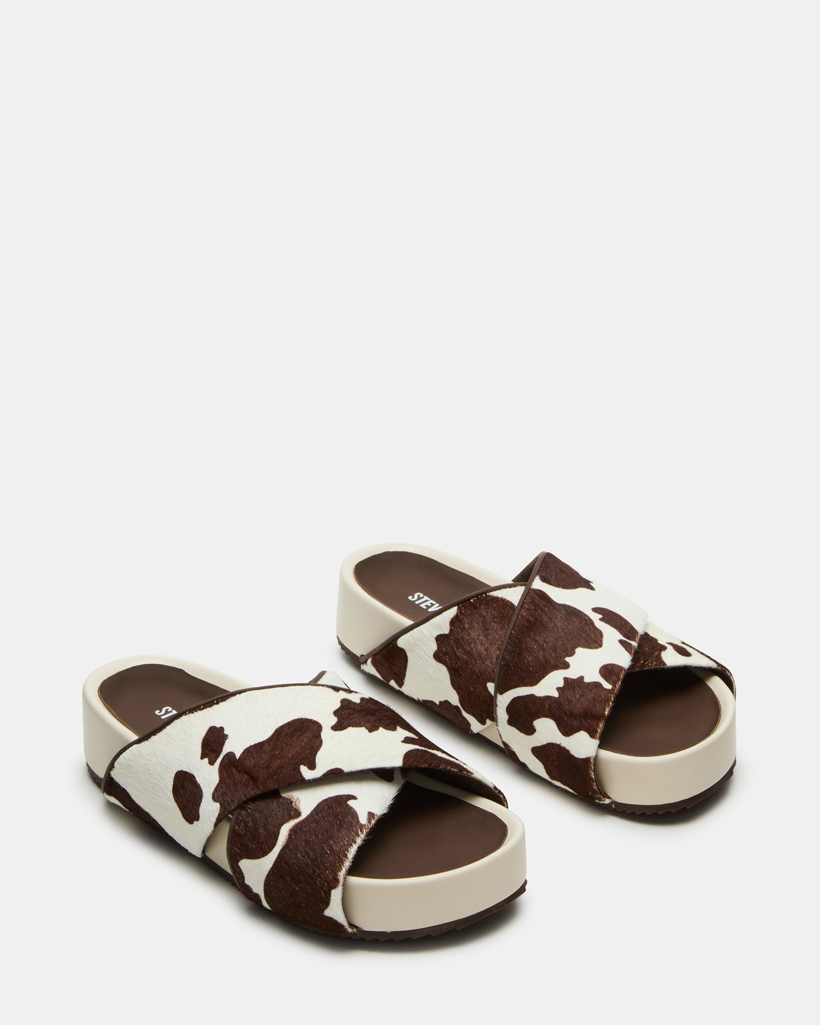 Close-up of the genuine leather upper with cow print pattern on AVENDRA sandals