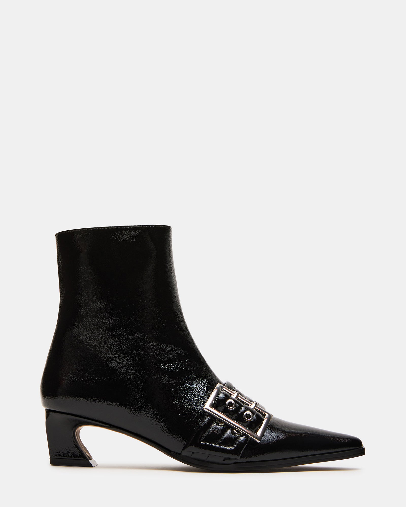 Side view of AXTON black ankle boots styled with skinny jeans