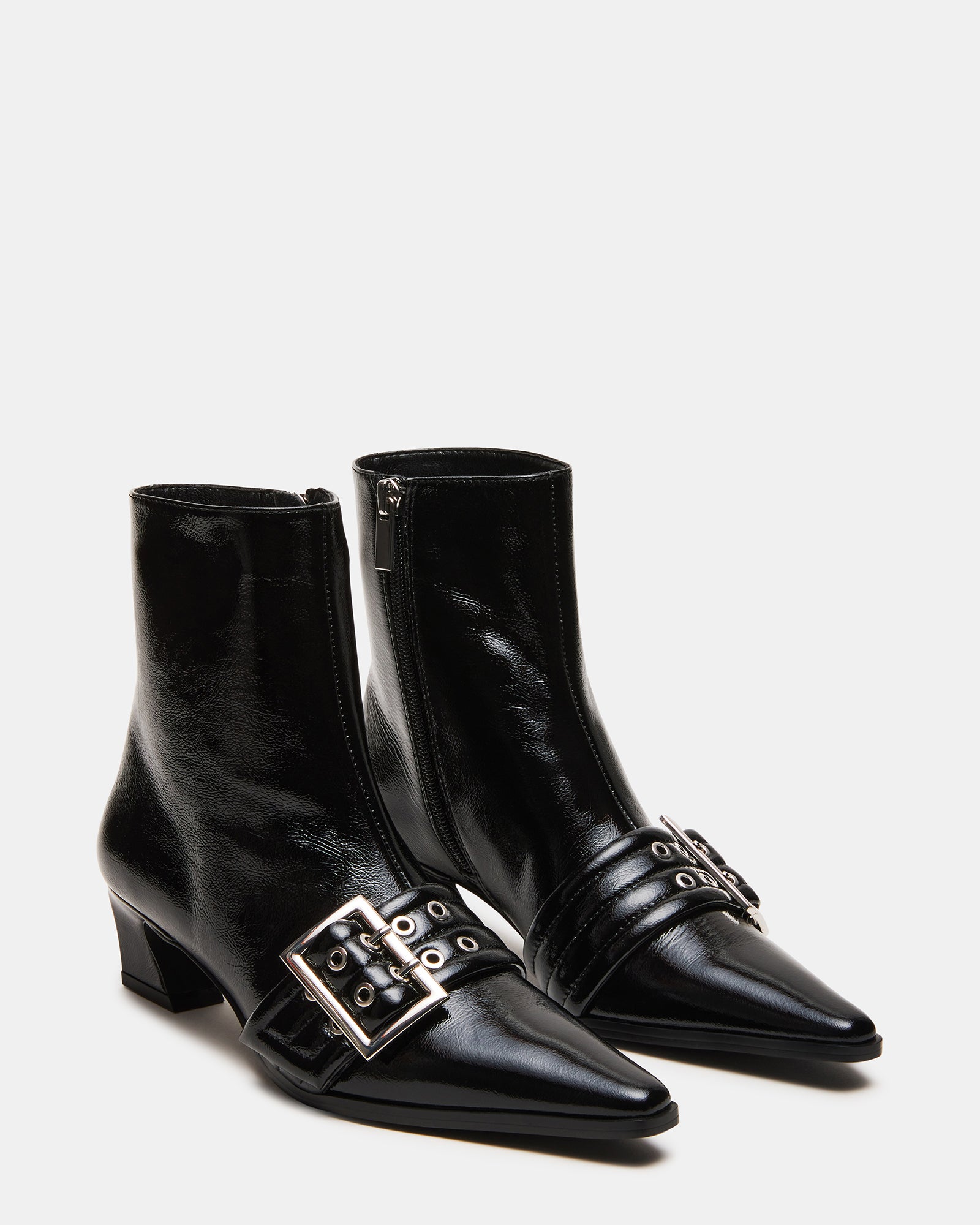 Woman walking in urban setting wearing AXTON womens ankle boots