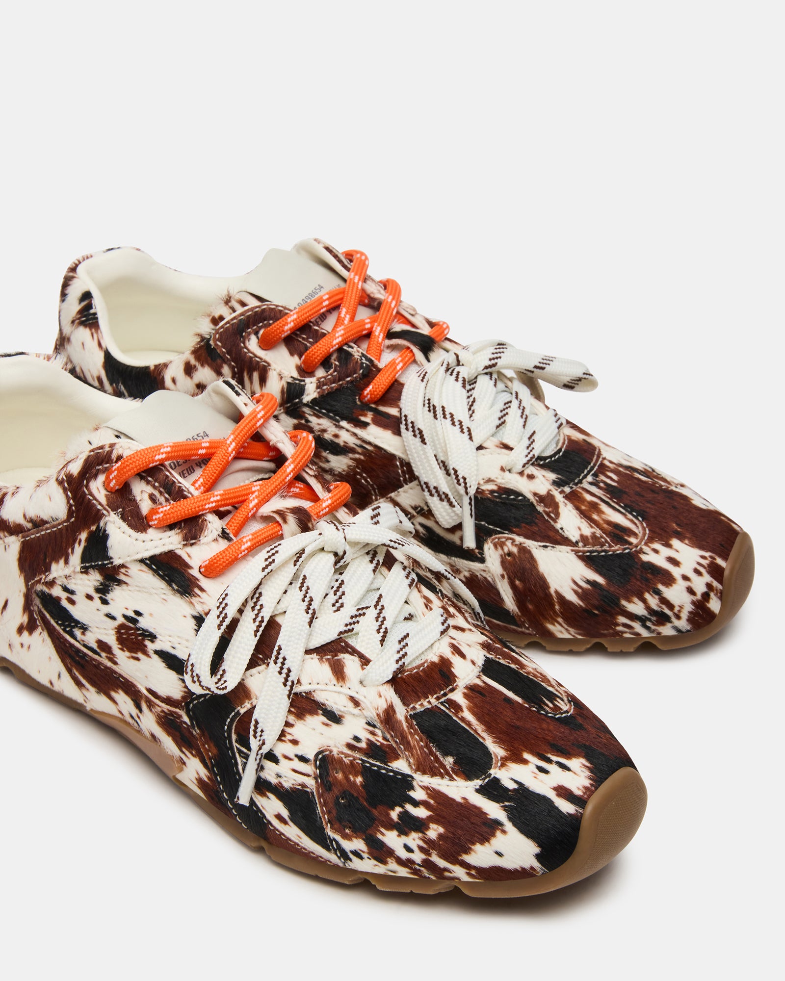 Close-up of the AZIEL Brown Leather Sneakers displaying the leather texture.