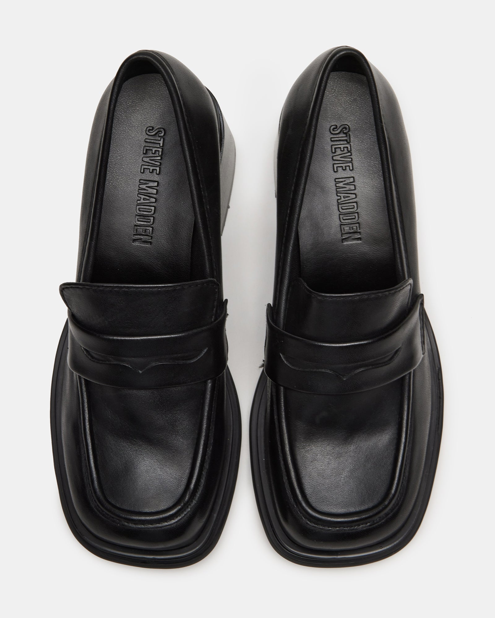 Close-up of the square toe design of Baxter black leather loafers.