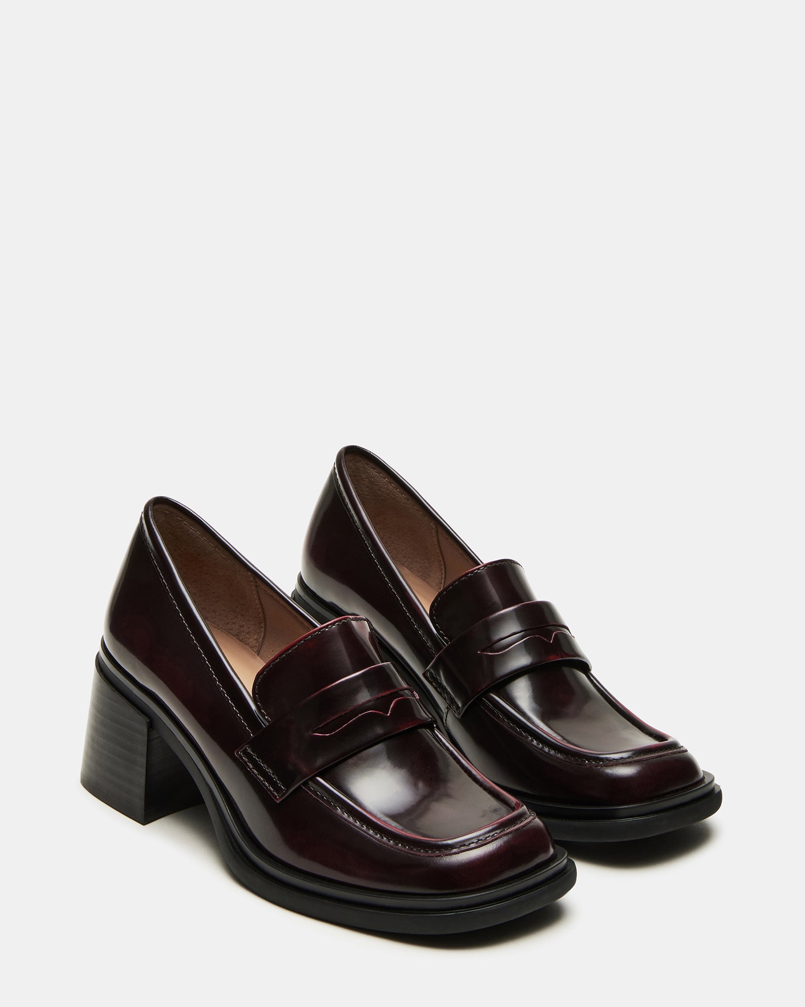 Close-up of block heel and square toe design on Baxter loafers