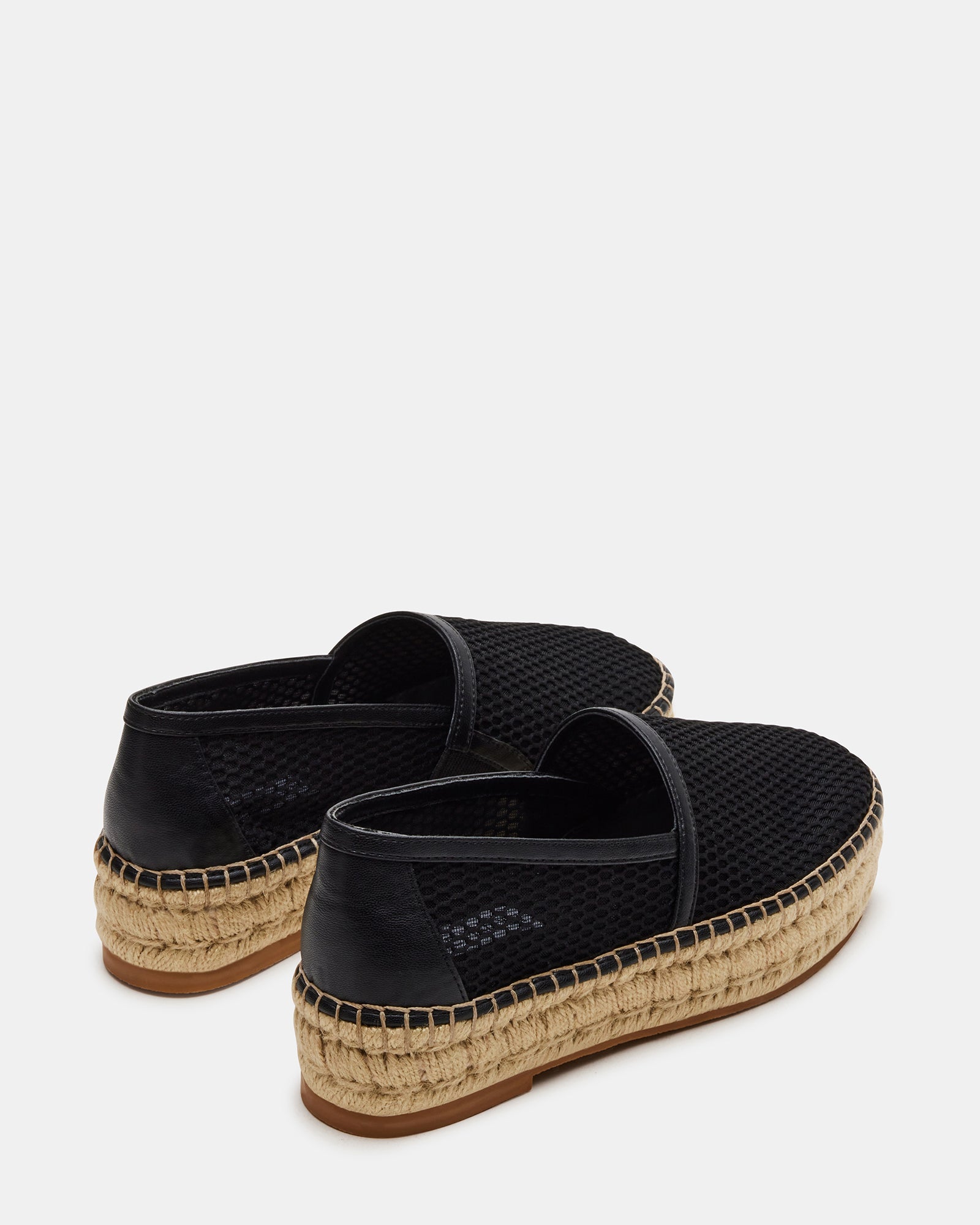Fashionable black espadrille shoes for women styled with summer outfits