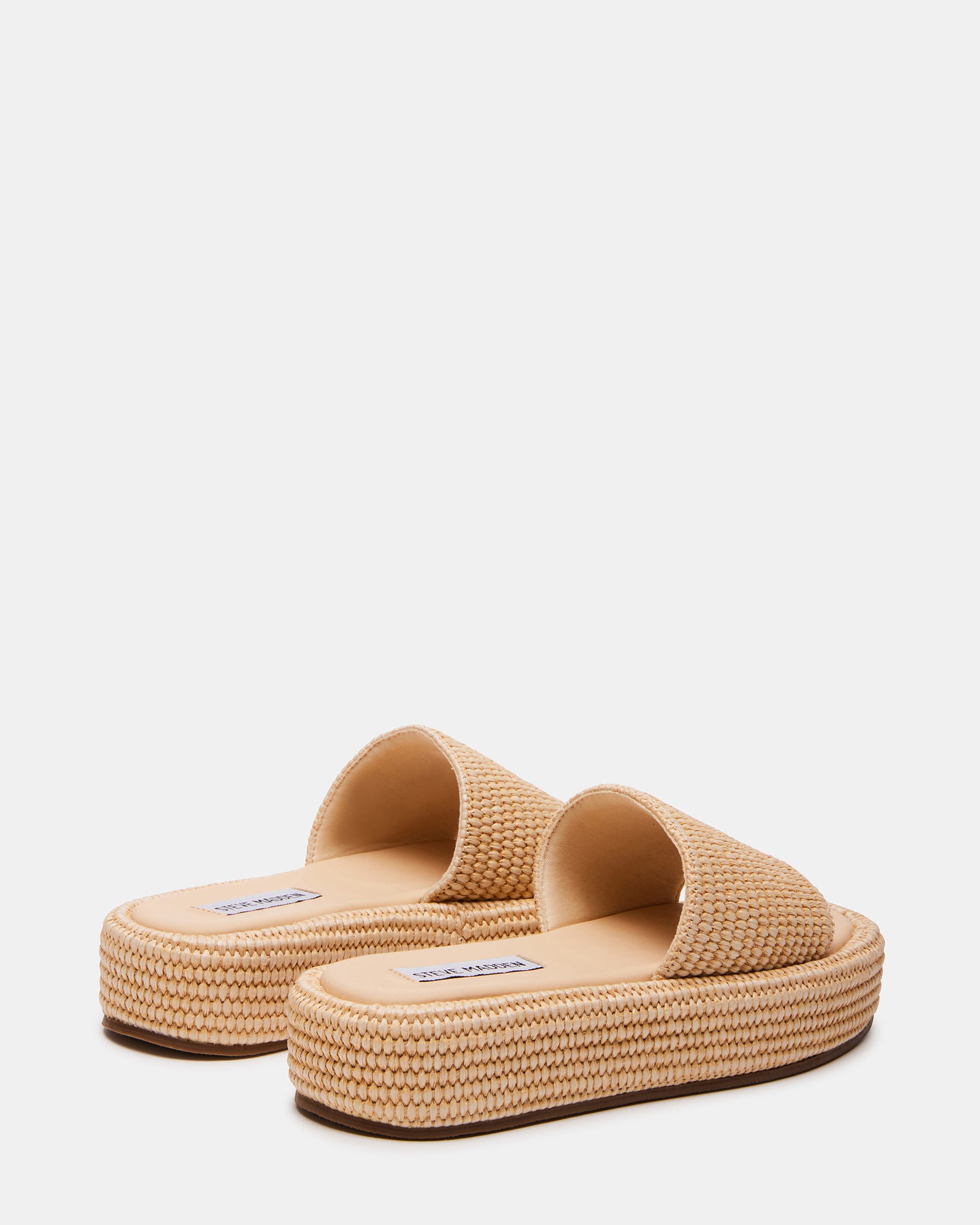 Side angle displaying 1.5" raffia sandals heels and woven texture