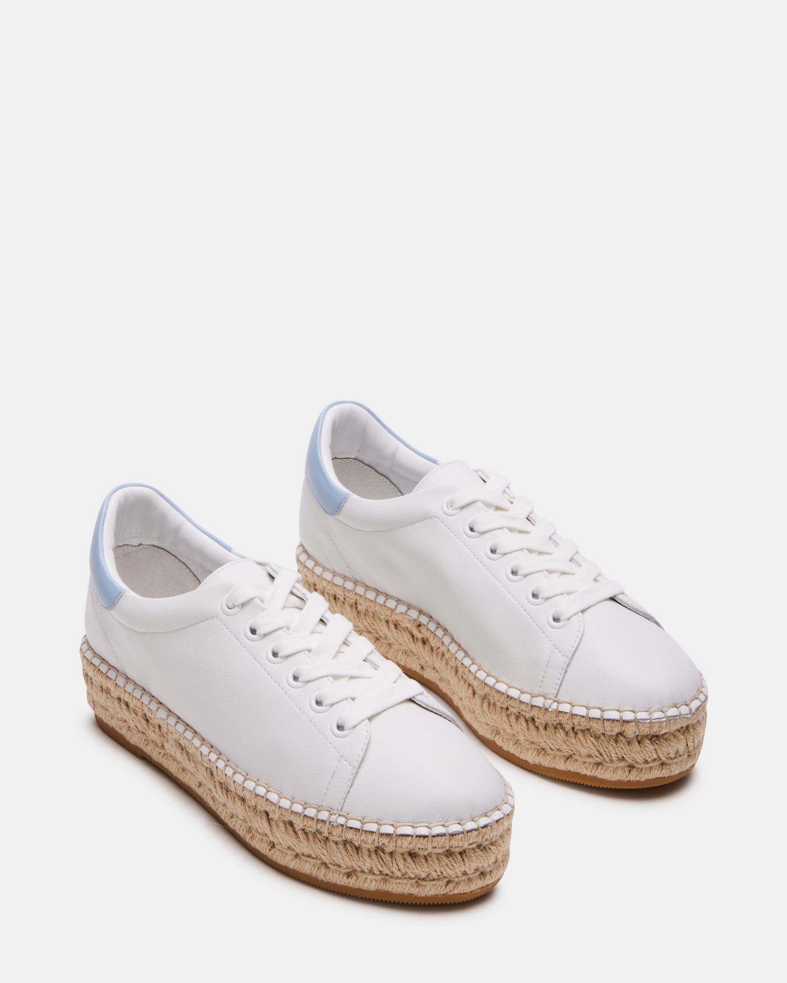 Side shot of the sneakers highlighting the contrast color back tab and heel height