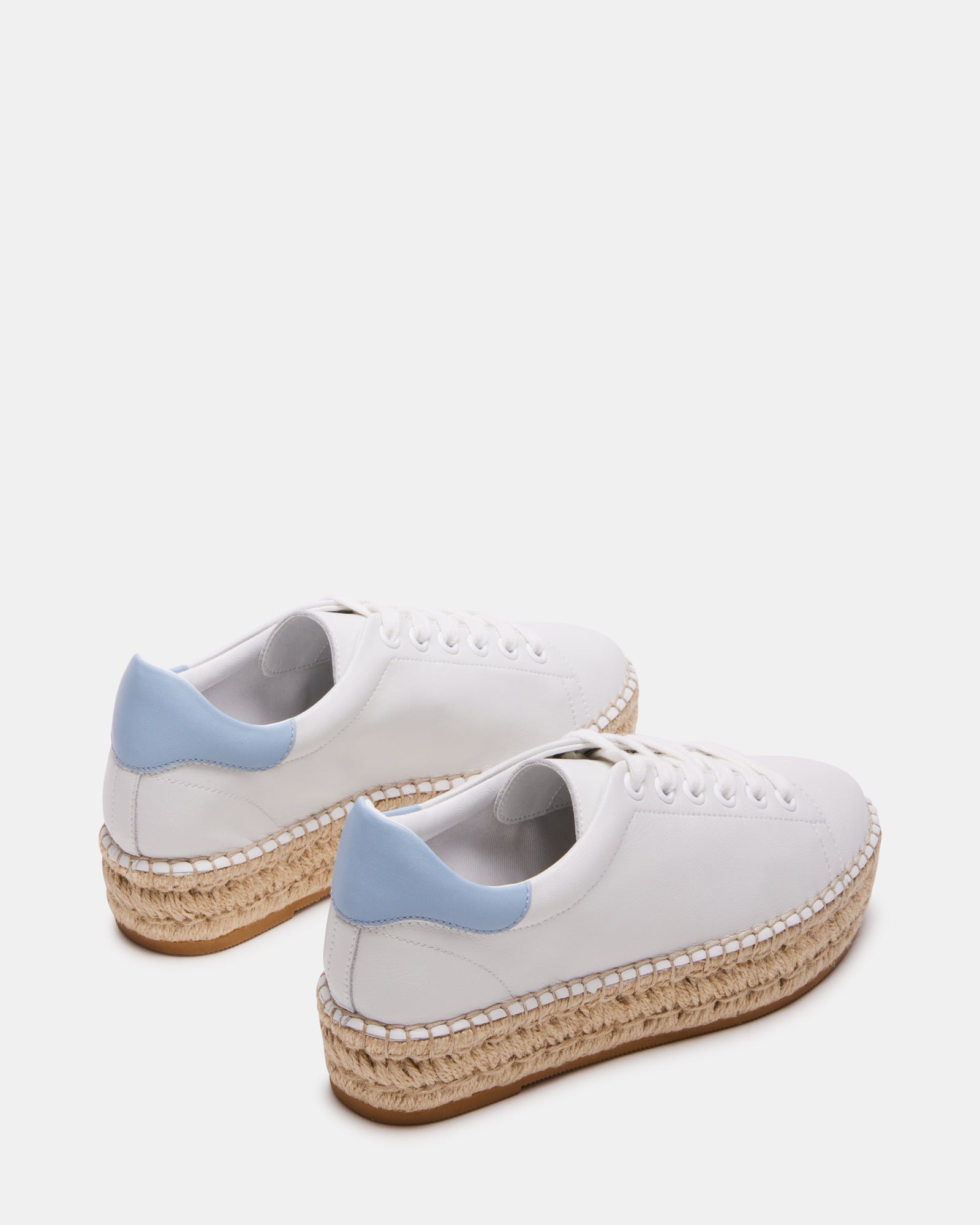 Side shot of the sneakers highlighting the contrast color back tab and heel height