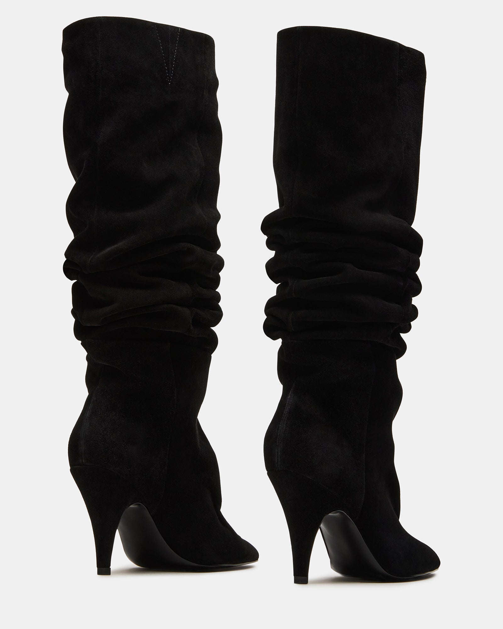 Back view of wide calf knee high boots showing flexible fit
