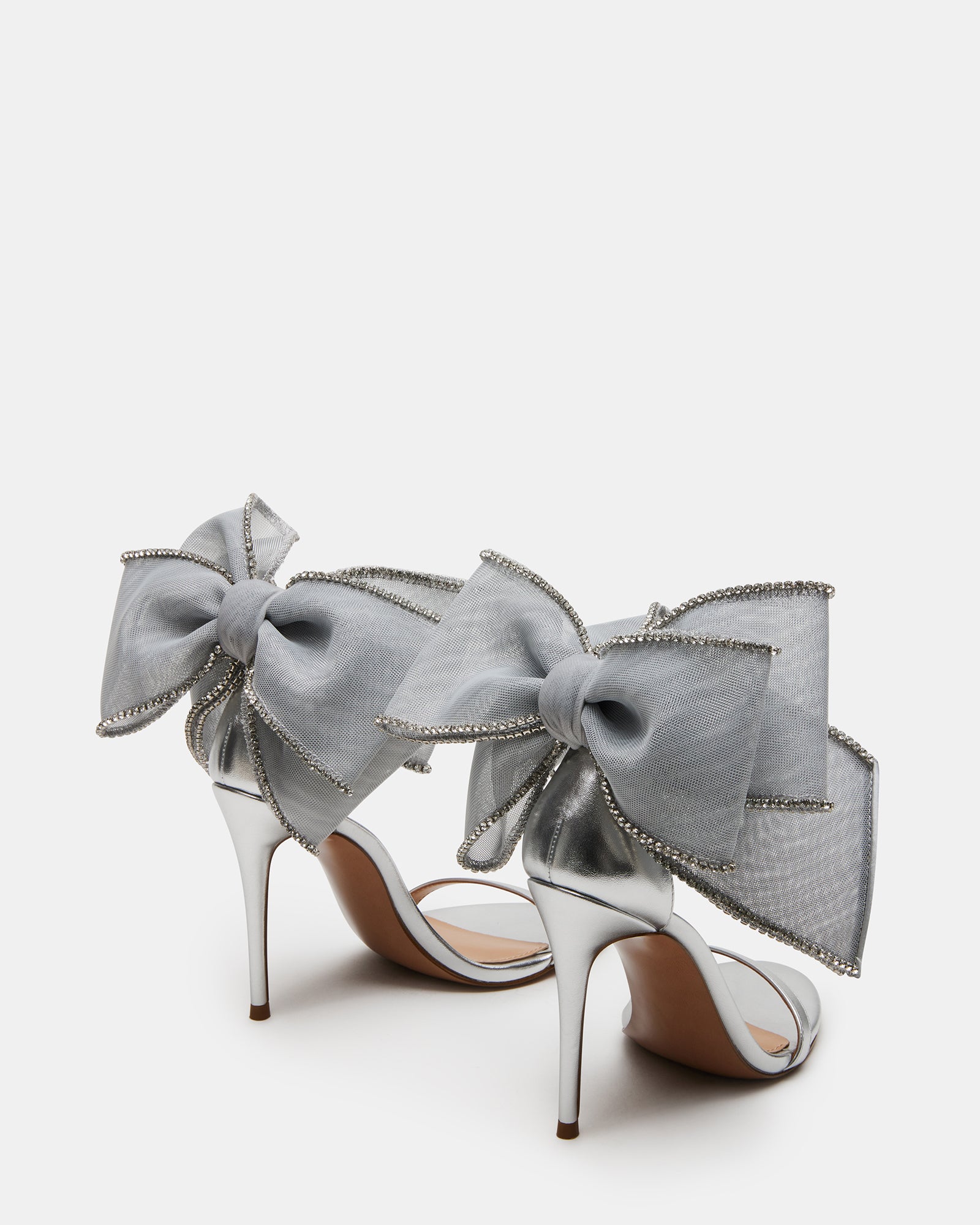 White stiletto heels styled for a summer rooftop event in Chicago.