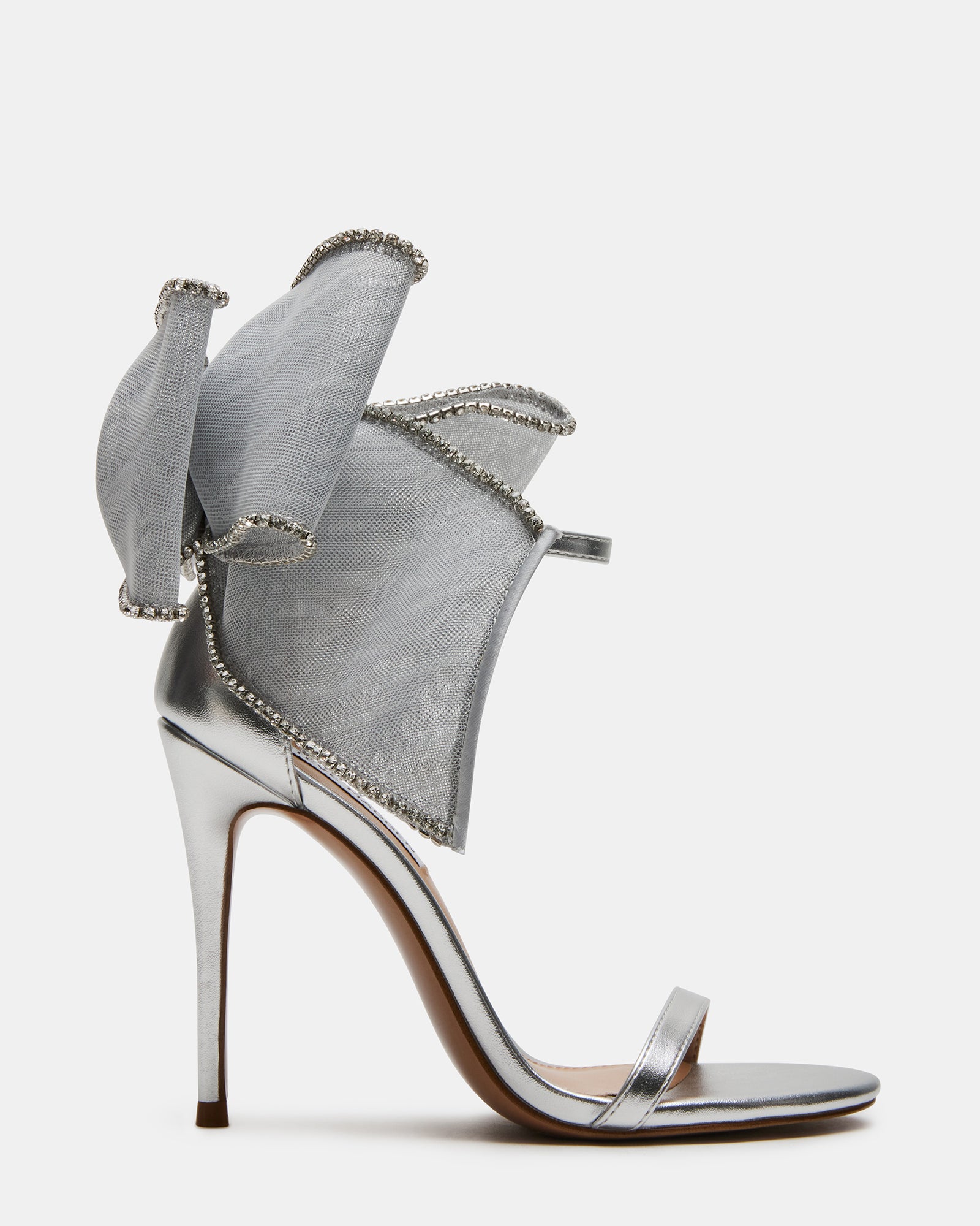 Side angle of platform stiletto heels showing rhinestone bow sparkle.