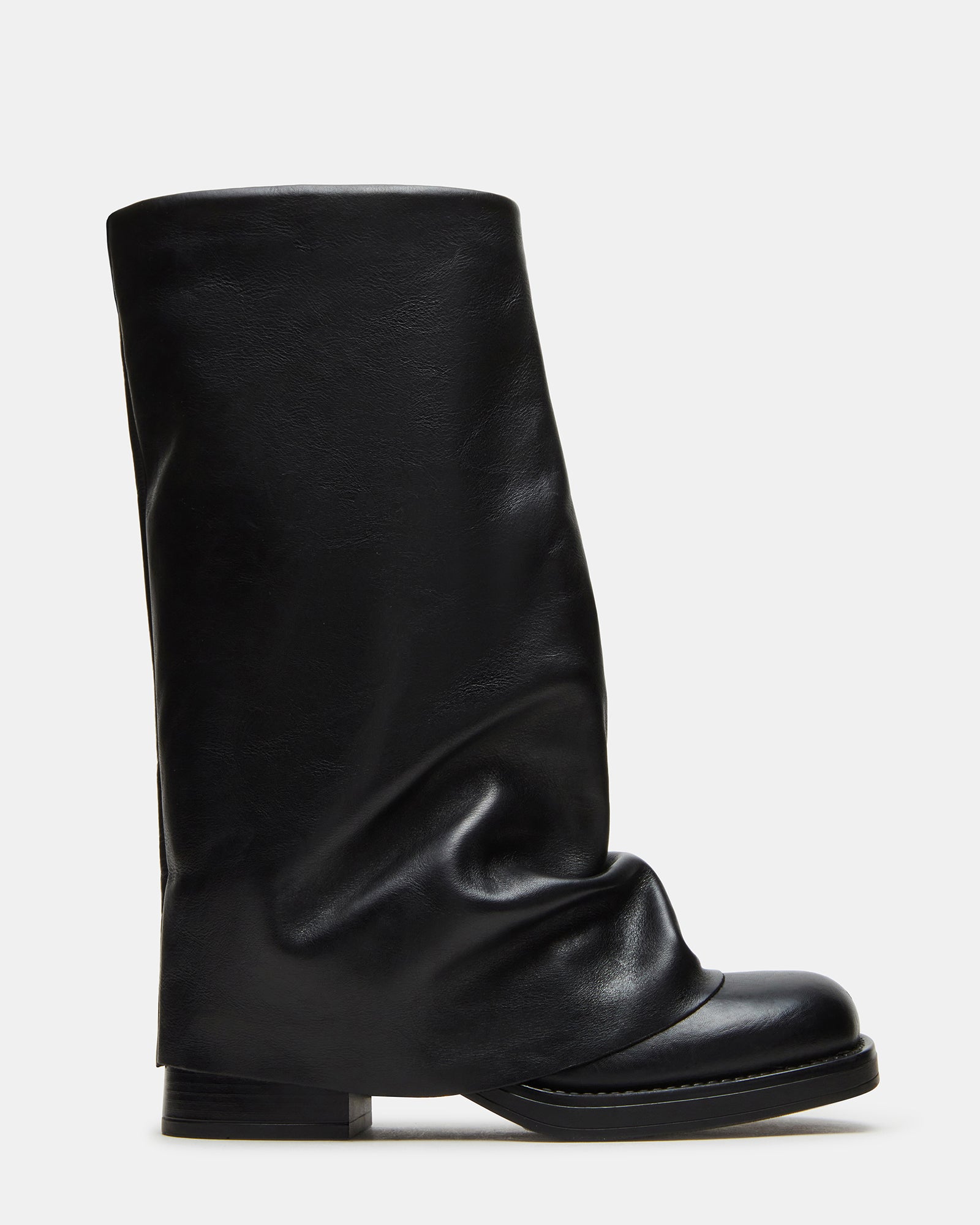 Side view of Benton cuffed boots in black leather against wooden flooring