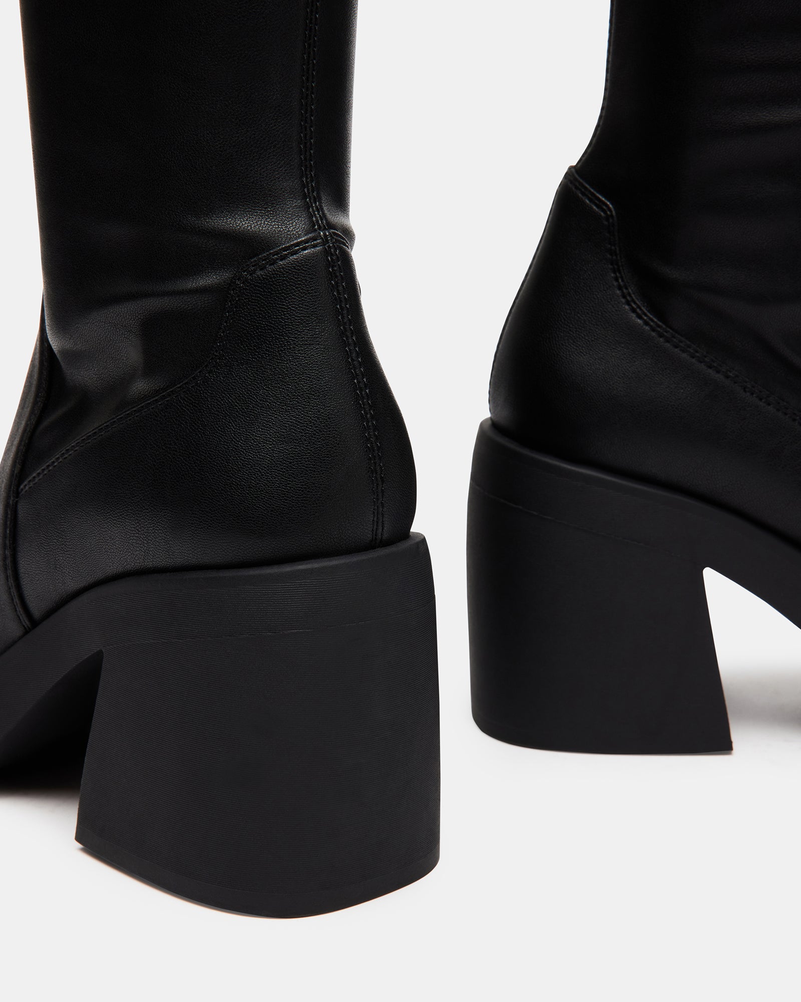 Berkleigh black wide calf knee high boots side view on a model