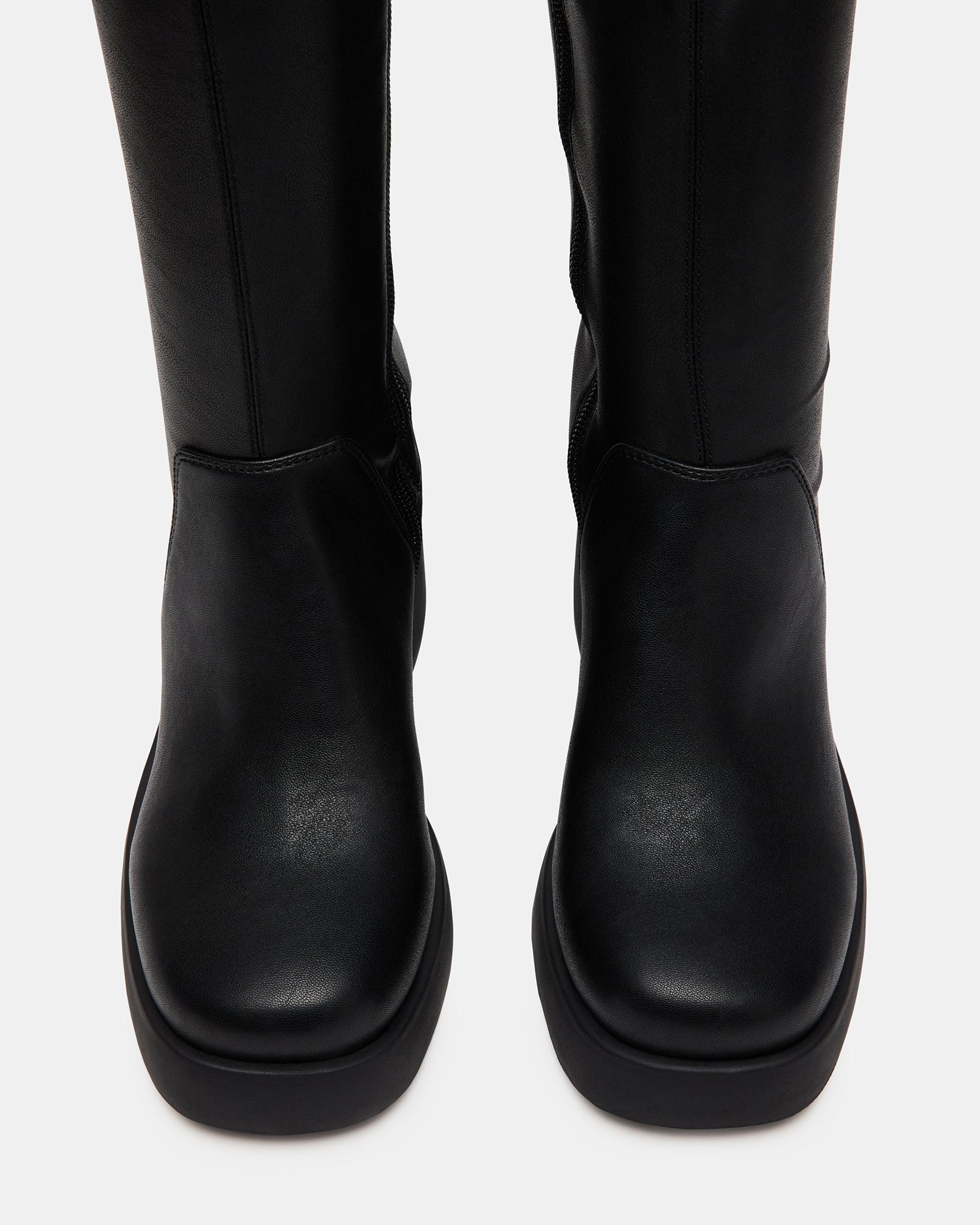 Berkleigh black wide calf knee high boots styled with casual attire