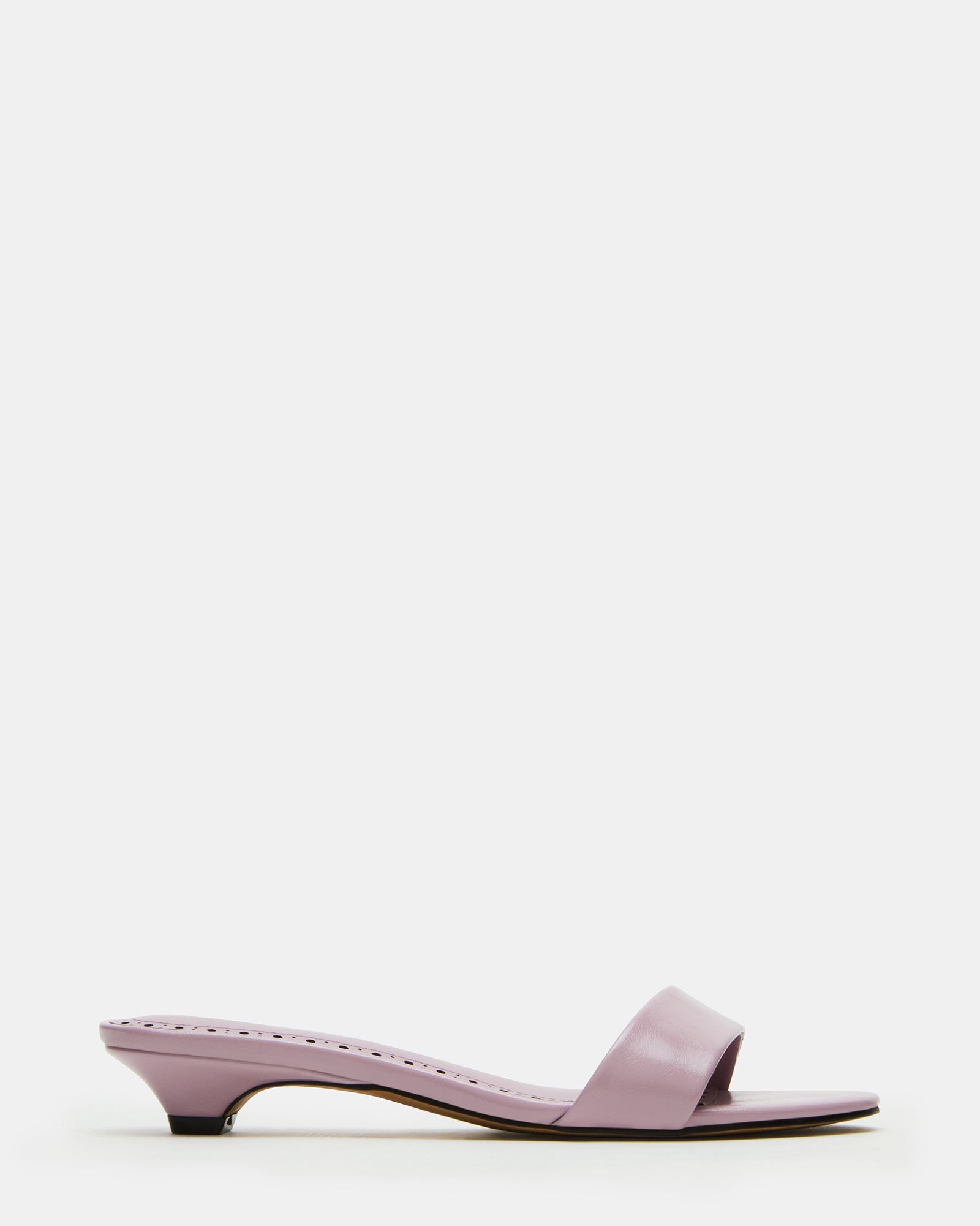 Front angle of blush kitten heel sandals styled with spring attire