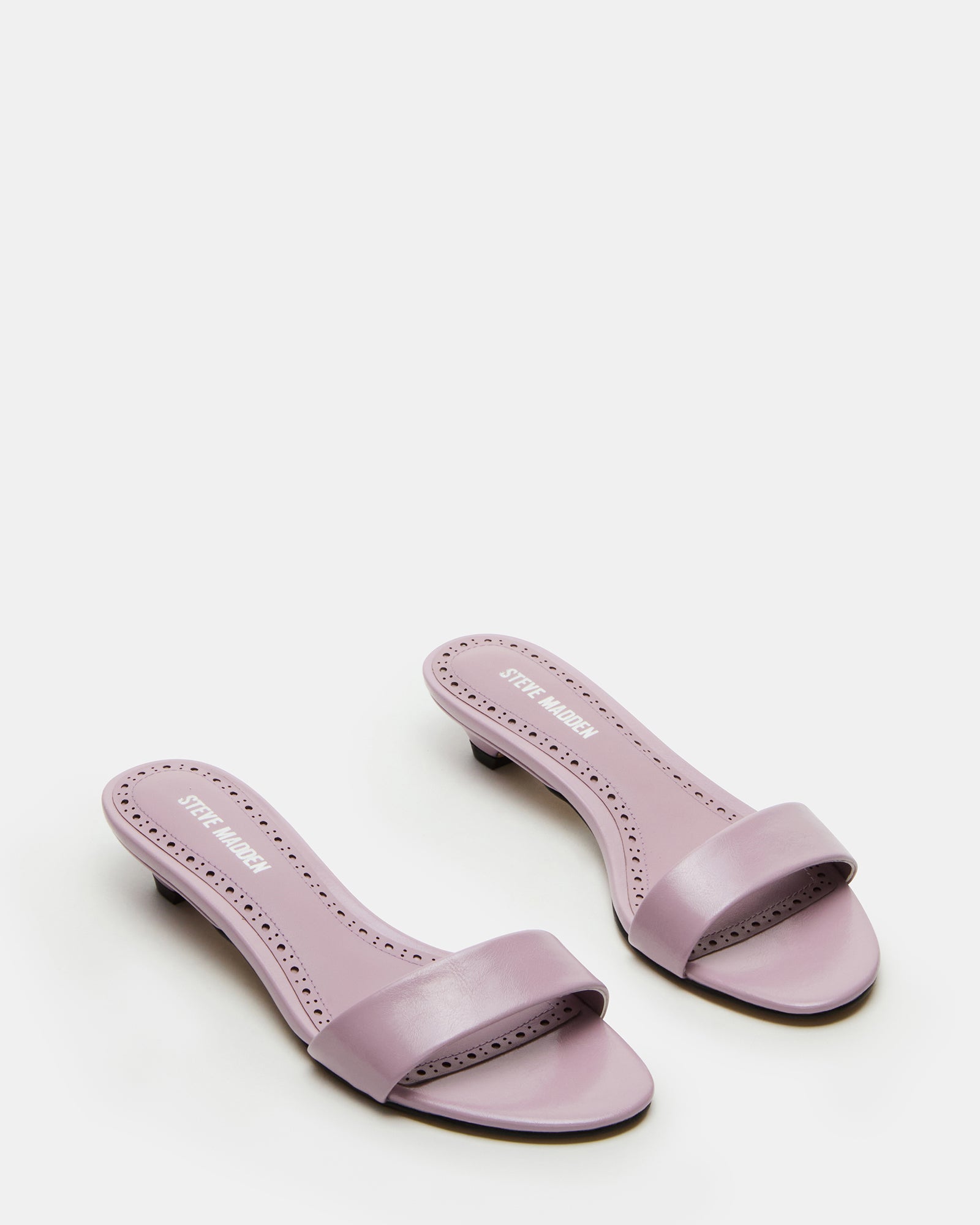 Closeup of rounded toe and leather sock detail on mule shoes