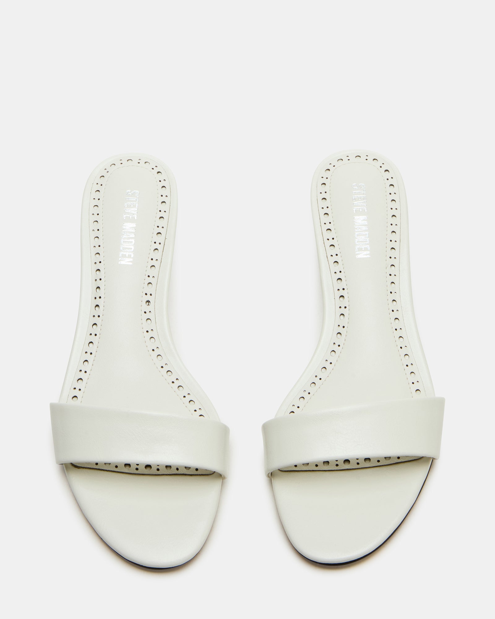 Close-up angle of the white kitten heel mule showing smooth vegan leather texture