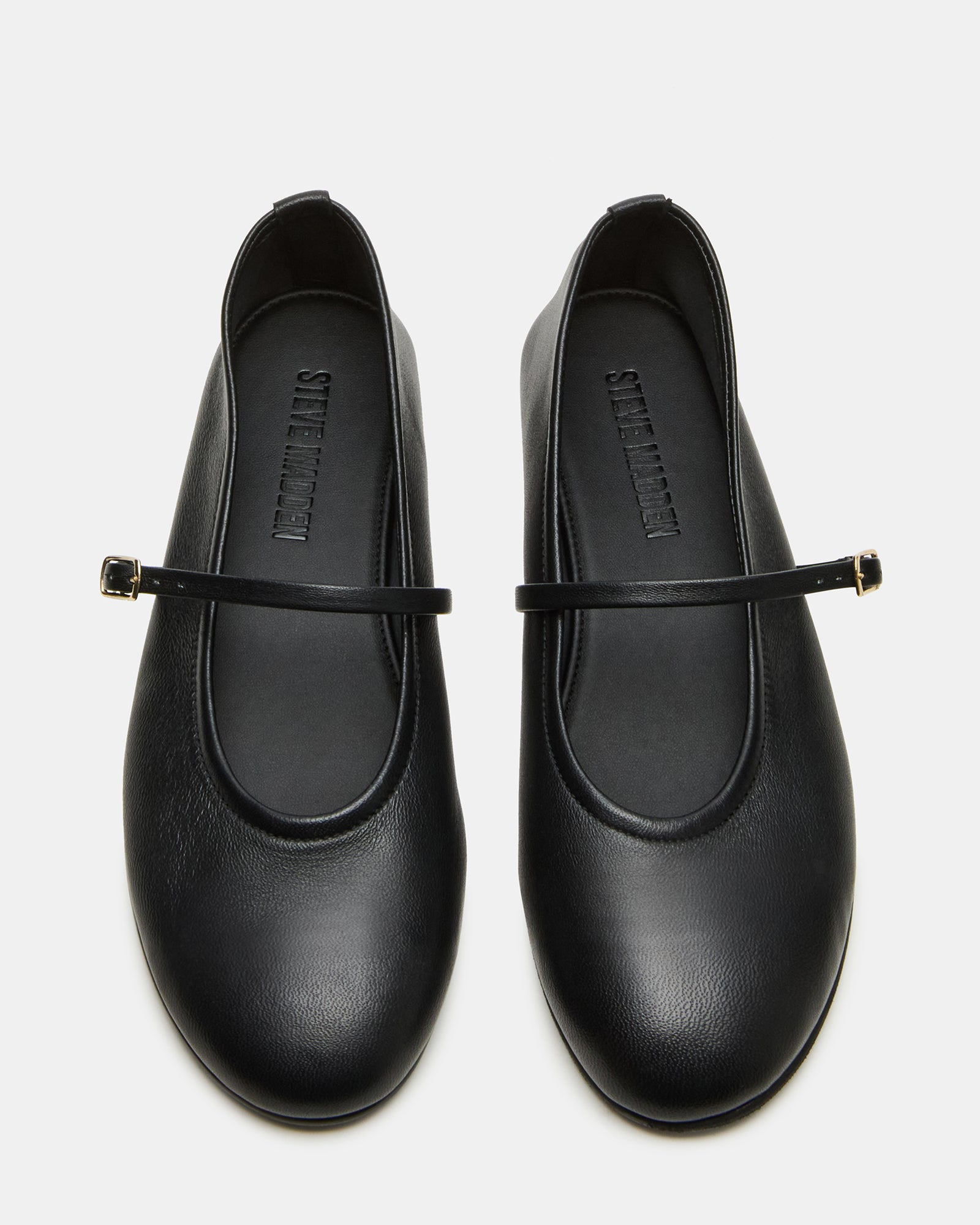 Close-up of Besette black Mary Jane shoes showing leather texture and toe design