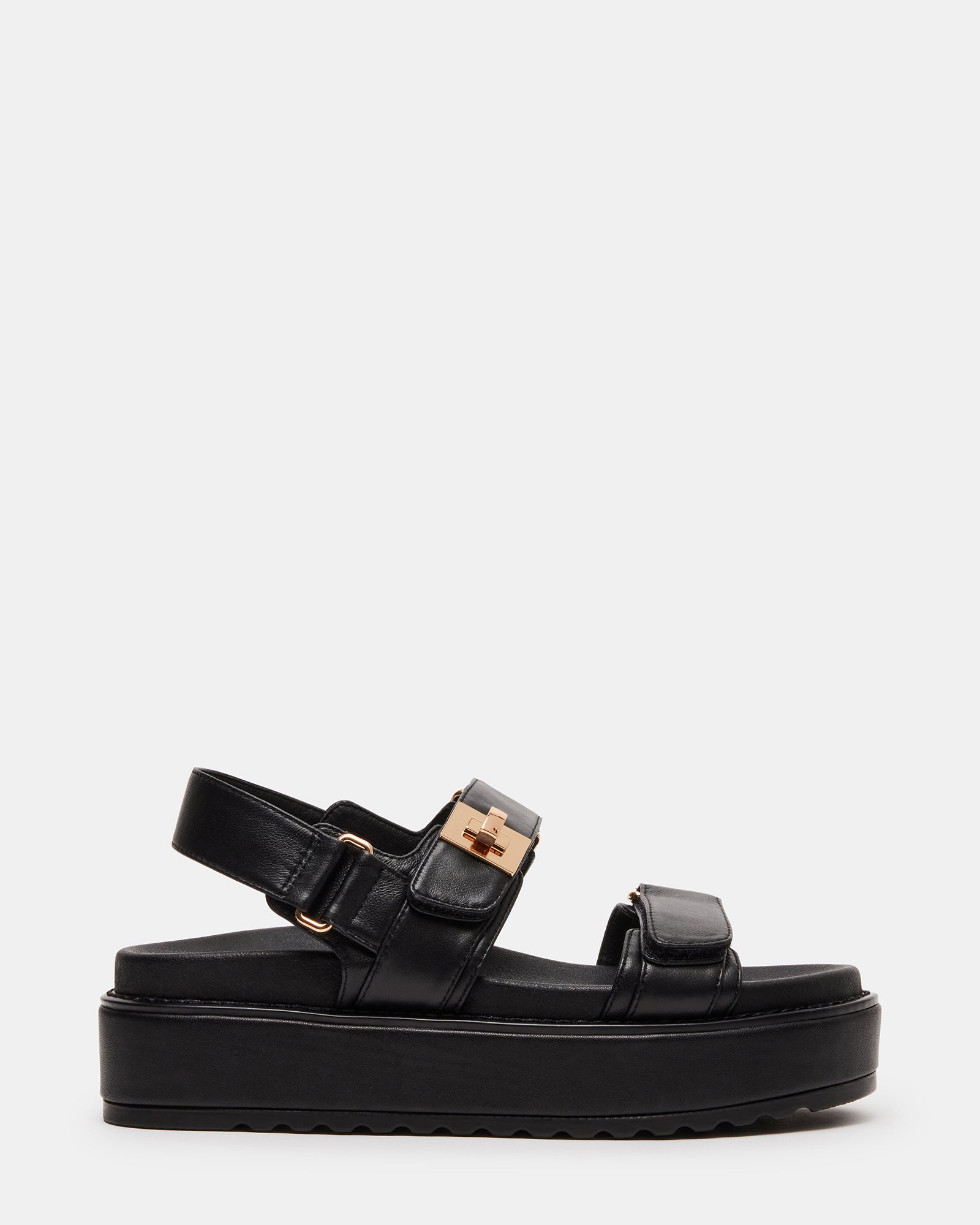 BIGMONA black leather flatform sandals shown on-foot with jeans