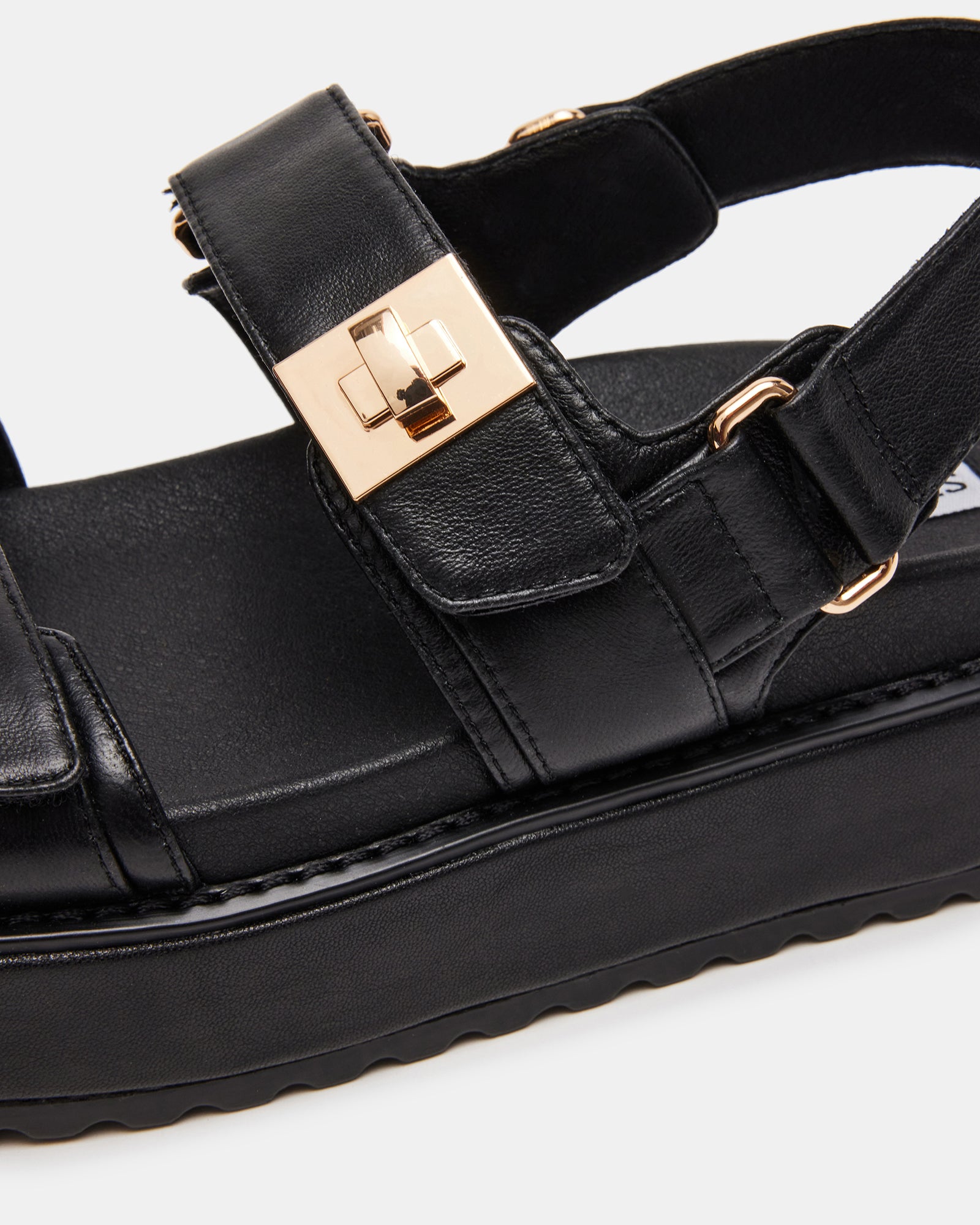 BIGMONA black leather flatform sandals shown on-foot with jeans