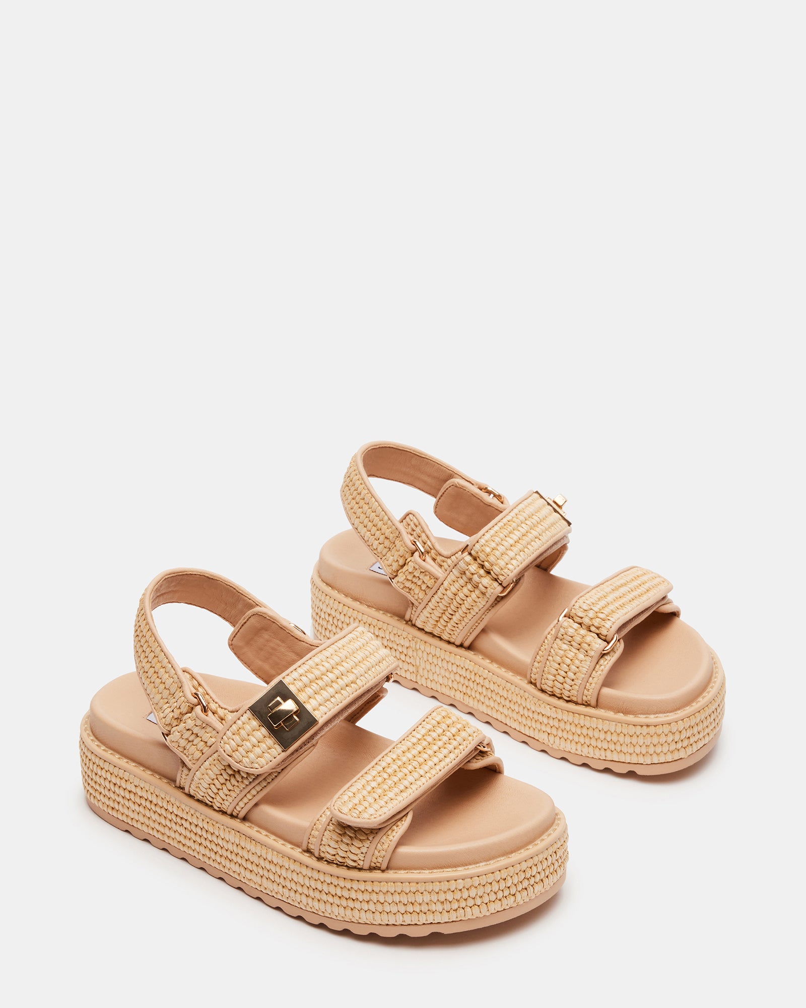 Close-up of womens Bigmona raffia platform sandal showcasing turnlock detail and molded footbed