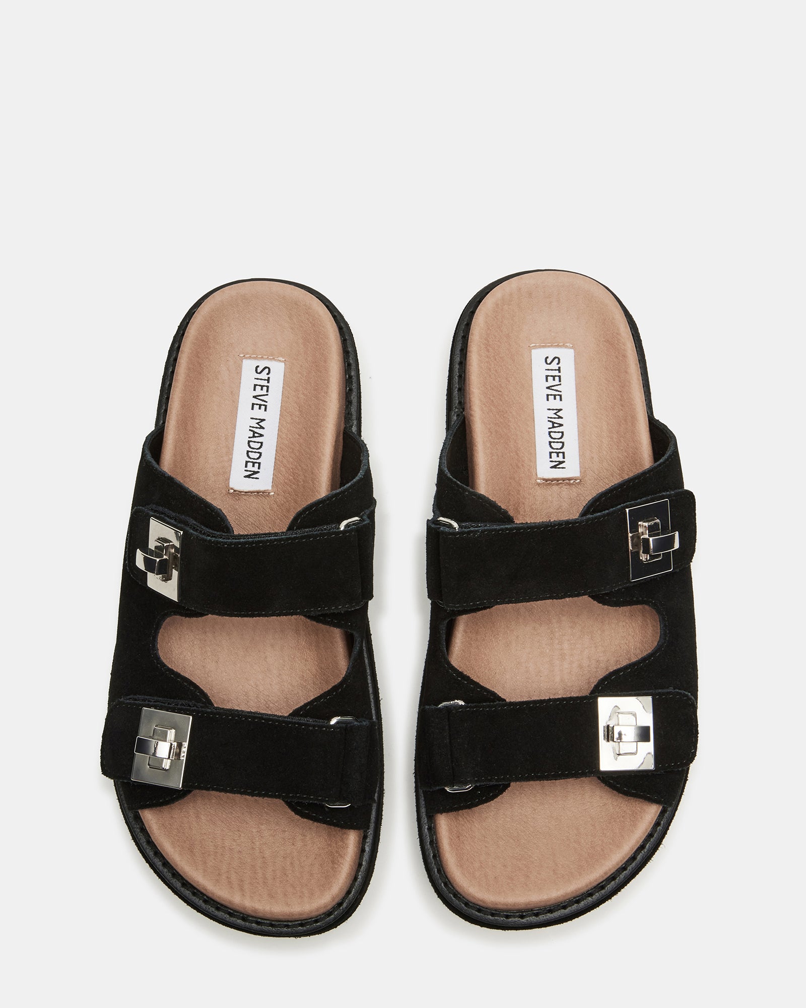 Side view of black suede platform slide sandals with turn-lock hardware detail